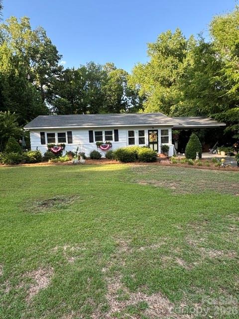 Welcome to 606 N Pine Lane. This 2-bedroom, 1-bath home features a comfortable living room, dining area, and functional kitchen. Property includes an attached carport and patio, plus an in-ground pool perfect for outdoor entertaining and summer enjoyment. Beautiful vinyl plank flooring was installed in 2024, and a new HVAC unit was installed in 2025, offering modern updates and added peace of mind.