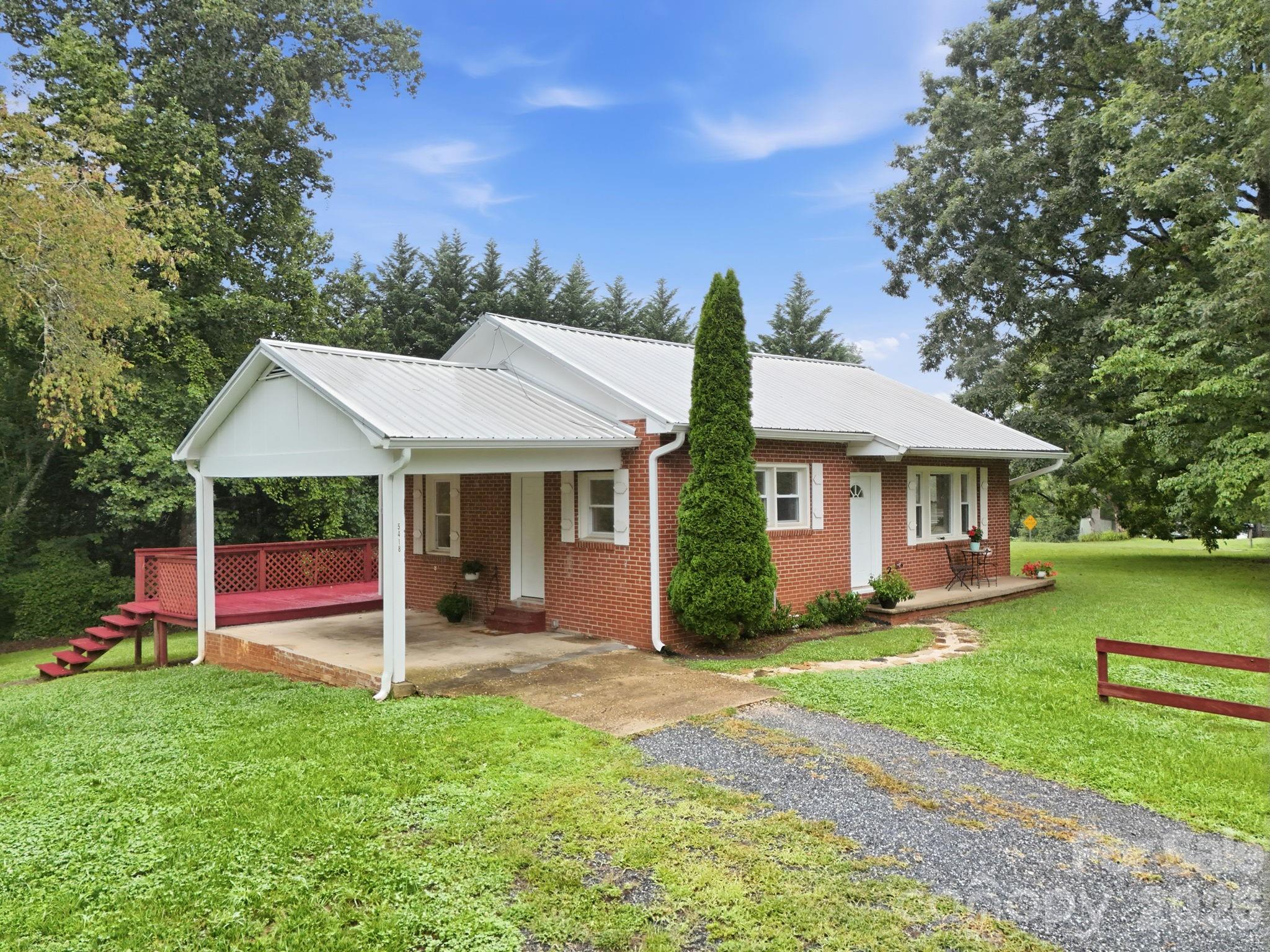 Welcome to 5418 Nix Creek Road, a beautifully maintained, move-in ready 3-bedroom, 1-bath home offering easy one-level living on a mostly level lot in a peaceful Marion setting. Filled with natural light, the inviting interior features an open, functional layout with attractive laminate flooring, warm butcher block countertops, stainless steel appliances, and a reverse osmosis water filtration system. A durable metal roof, installed just five years ago, adds lasting value and peace of mind.

Step outside to the expansive rear deck overlooking the spacious backyard—perfect for morning coffee, outdoor dining, entertaining friends, or simply relaxing while enjoying the serene surroundings. The generous yard provides plenty of room for gardening, pets, play, or future outdoor projects.

Conveniently located just a short drive from both Marion and Asheville, this home offers the ideal blend of peaceful country living and everyday convenience. Whether you're searching for your first home, looking to downsize, or seeking a turnkey investment property, 5418 Nix Creek Road is ready to welcome its next owner.