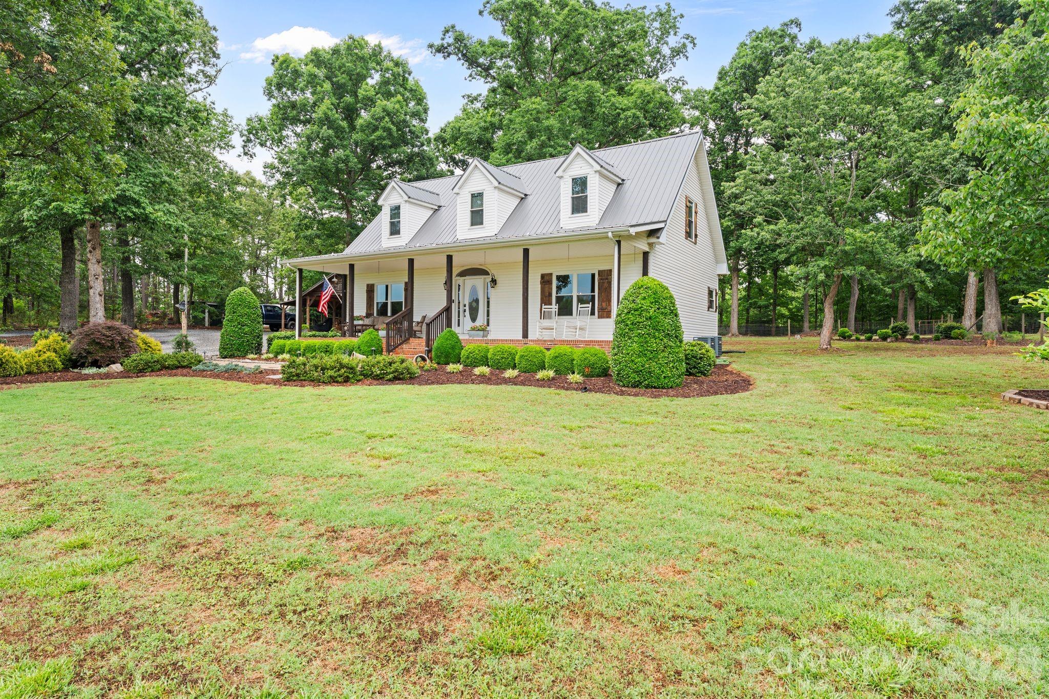 Some homes just feel easy the moment you pull in — and this one has that kind of peaceful, country-living charm buyers are always searching for.

Approximately 7 beautiful acres, this 3 bedroom, 2.5 bath home offers the space, privacy, and flexibility that are getting harder to find around Catawba and the greater Lake Norman area. Whether you’ve been dreaming of room for animals, a garden, hobbies, outdoor living, or simply a little breathing room, this property gives you the freedom to make it your own. No HOA!

Inside, the home has been thoughtfully updated with fresh interior paint, a newly remodeled primary bathroom, and granite countertops in the kitchen, complete with a farmhouse sink that adds just the right touch of country charm. The primary bedroom is conveniently located on the main level, creating an easy layout for everyday living.

Upstairs, the loft adds bonus space that can grow with your lifestyle — use it as a playroom, homeschool area, movie room, office, or game room. It would also make a great spot for a pool table or hangout space.

Outside is where this property really shines. The acreage is fully fenced and ready for livestock, giving buyers a rare opportunity to enjoy a more self-sufficient, rural lifestyle without sacrificing comfort. The property also includes a two-vehicle carport with a lean-to, plus a storage building added in 2019, making it easy to store equipment, tools, feed, outdoor gear, or recreational toys.

Major updates have already been taken care of, including a new metal roof in 2022, new windows in 2016, a new back door in 2026, and updated landscaping. A custom built gas log fireplace with its own tank adds warmth and character, making the living space feel cozy and inviting.

With usable acreage, thoughtful updates, space for animals, and that quiet country feel so many buyers are craving, this home is more than a place to live — it’s a place to slow down, spread out, and enjoy the kind of lifestyle people move to this area for.