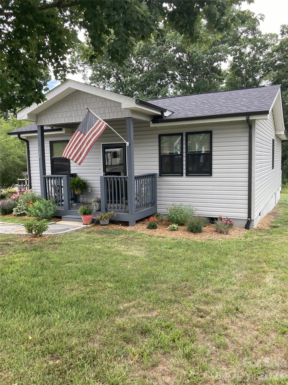 Lovely, totally renovated home-from top to bottom-with an addition on rear. This home features an open concept living area, great for entertaining, along with 3 bedrooms and 2 full baths. Personalized add-ons by Seller include custom shades in kitchen/dining area, stunning light fixtures, walk-in shower, full view storm doors, firepit and a 10x20 storage building. Relax with lemonade on the patio or enjoy S'mores by the backyard firepit.  Located on a quiet street and is close to town. Asheville, Charlotte and the North Carolina High Country are all just about one hour away.