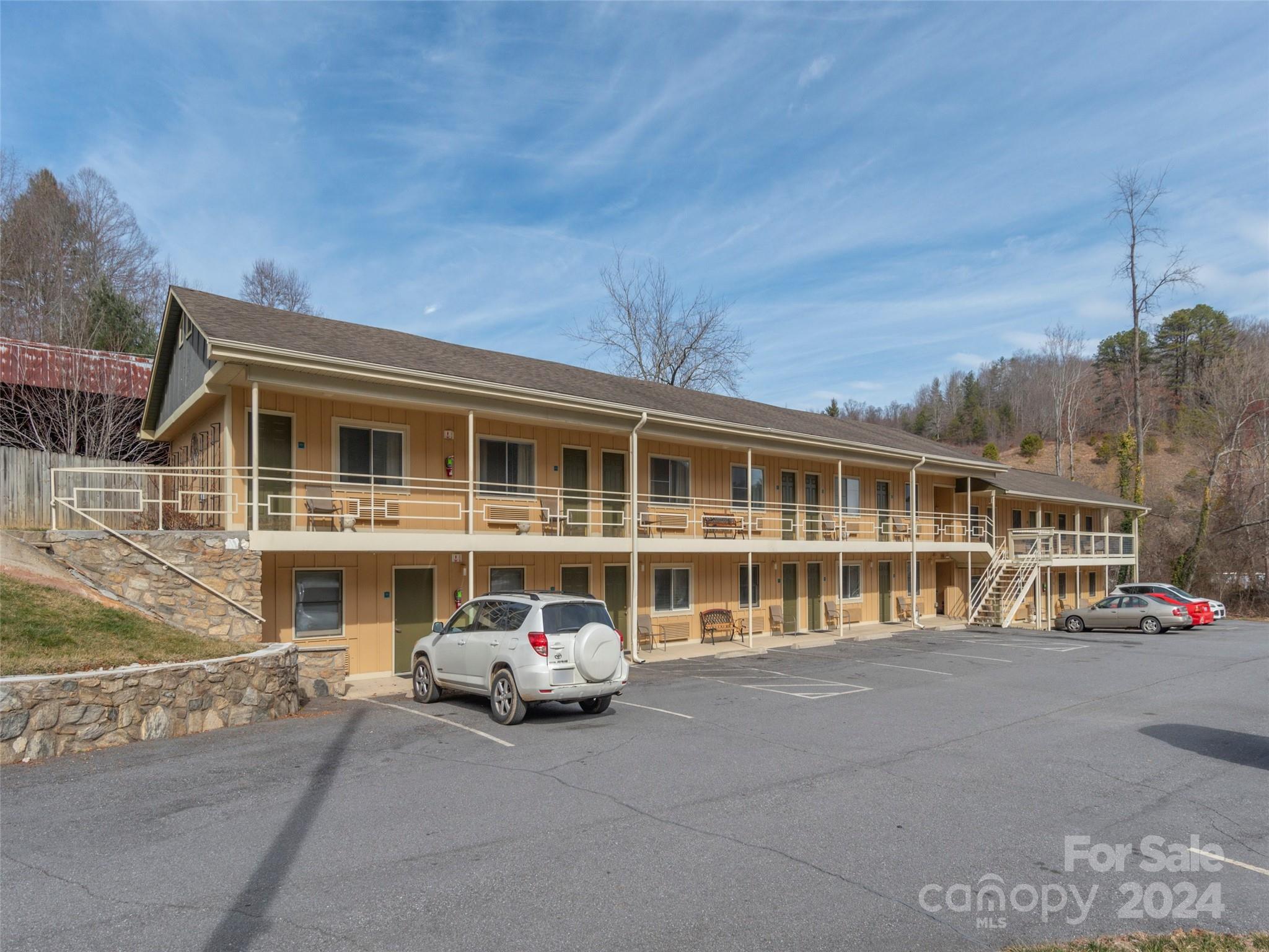 20 room family owned motel in the heart of Haywood County between Maggie Valley and Waynesville on Dellwood Rd. 5 bedroom brick home, included, currently serving as managers quarters, laundry, and office building. 10 rooms have new heating units. 10 need new units. No formal financials to share. Current rates are 79/night or 375/week. 25 min to Harrah's Cherokee Casino. 10 min to Blue Ridge Parkway. 10 min to Main St. Waynesville.