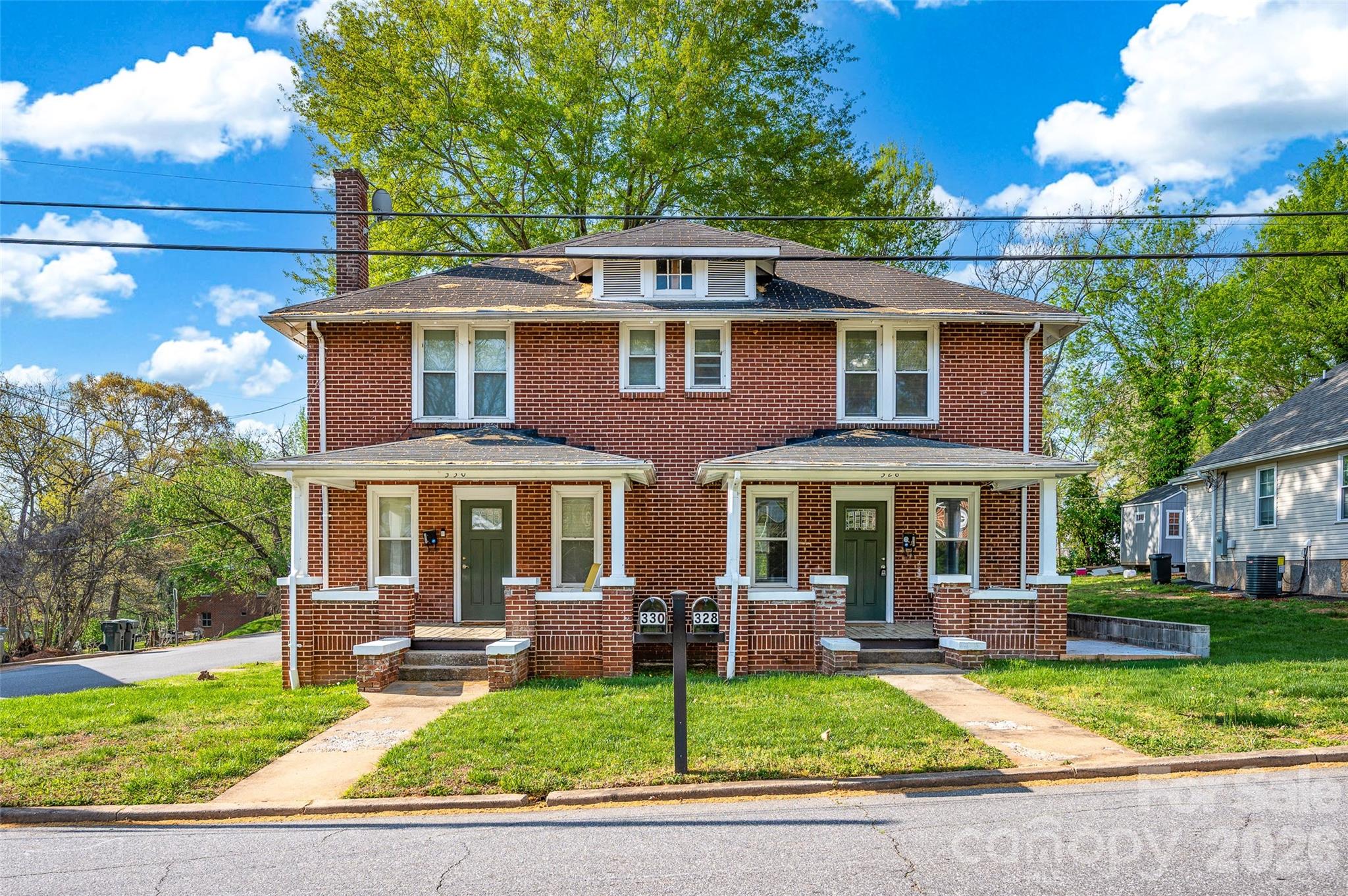 What an amazing opportunity for an investor or for an owner occupant to have a wonderfully maintained duplex in a desirable area; Tenants pay all utilities; The right side is currently for rent in the Canopy MLS at $1300/month plus utilities; The left side is rented for $1300/month plus utilities and expires Dec 31, 2026; The right side is rented for $1300/month plus utilities and expires in May 2027; Enjoy the full brick exterior which is just so classic; Covered front porches and covered rear porches; Upgrades to the home include insulated windows, insulated front doors and refinished hardwood floors and ceramic tile in both baths; Features include neutral interior paint, classic wood trim throughout, updated bathrooms with tubshowers, elongated toilets and updated vanities/sinks; The kitchens include the refrigerators, microwaves and electric stoves; 2nd floor bedrooms are of good size and each has a closet; The seller makes no representation of the living room fireplaces and whether they function properly; Each side of the duplex has its own walk-down and walk-out unfinished basements with laundry hookups; The washer and dryer for #330 is included in the sale but the #328 tenant owns the washer and dryer and they are not included; The stairs to the 2nd floors of this home are so solid and quiet; Tenants can enjoy the rear patio as well as both front and rear covered porches; Gas lines are on the property but they are not hooked up; Come visit this classic, full brick home today!