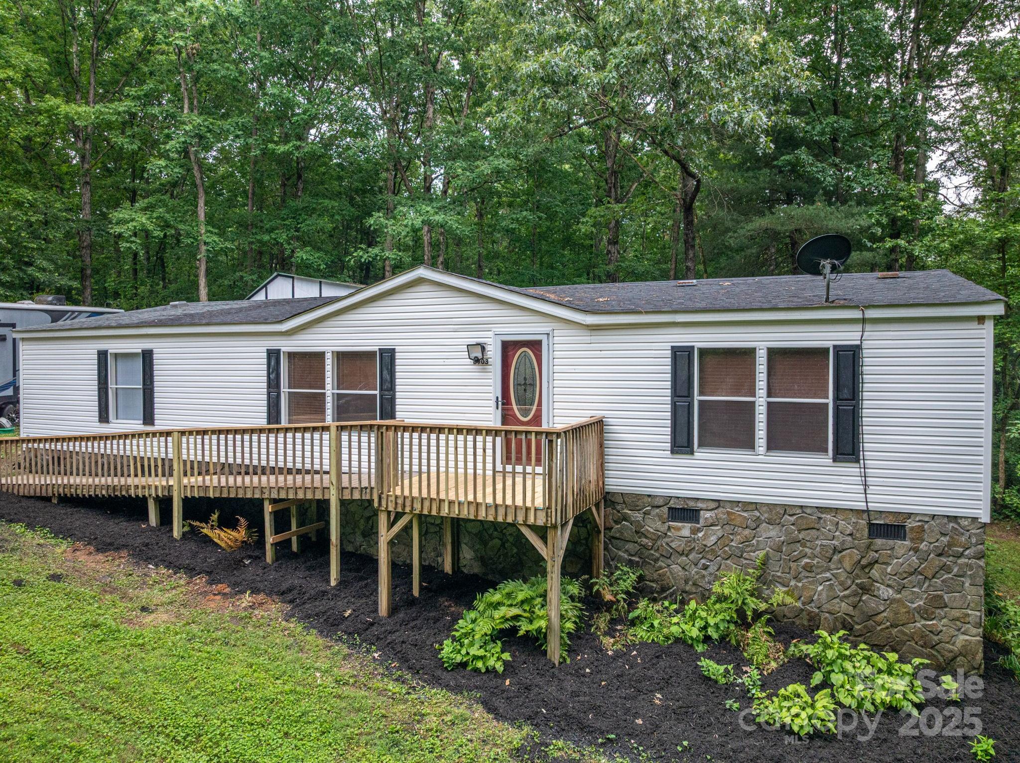 Tucked at the end of a quiet cul-de-sac, this 3-bedroom, 2-bathroom home offers over 1,500+/- sqft of move-in ready living space on just over an acre. With a partially wooded lot and surrounding trees, the setting offers a sense of privacy and seclusion that feels even more expansive than the acreage. Inside, you'll find brand-new flooring throughout, fresh interior paint, and a functional layout filled with natural light. A large shed provides additional storage or workspace, making this property as practical as it is peaceful. A rare blend of space, comfort, and quiet—ready for you to move right in!