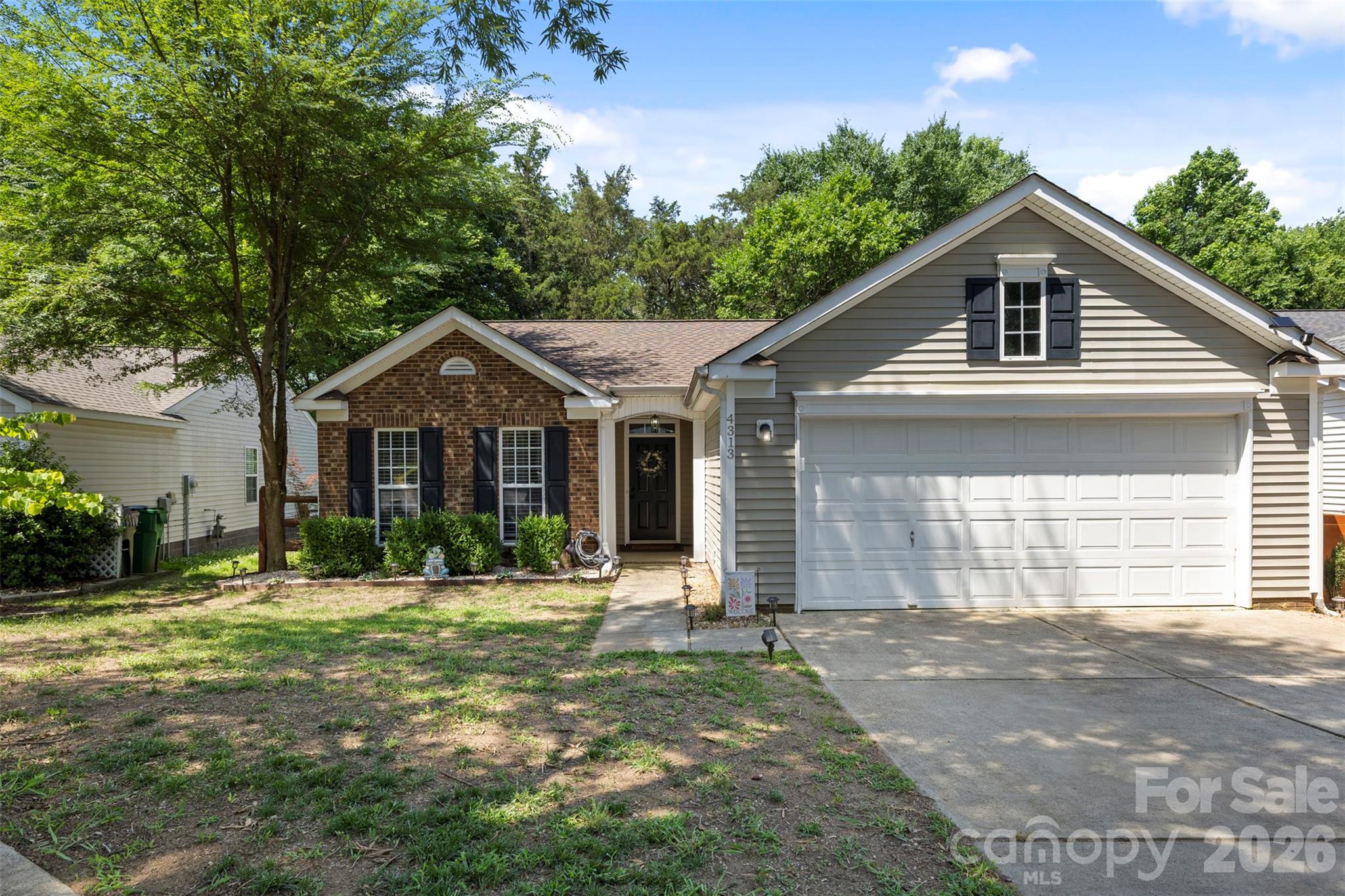 Welcome Home to Planters Walk – Where Comfort Meets Community!

Don't miss this charming 3-bedroom, 2-bathroom home nestled in one of Charlotte's most sought-after family-friendly communities in the Steele Creek area. With 1,223 square feet of thoughtfully laid-out living space, this home checks every box for comfort, lifestyle, and value.

Step inside and feel instantly at home. The inviting living area features a wood-burning fireplace — perfect for cozy Carolina evenings — and flows naturally into the dining and kitchen spaces. The layout is ideal for both everyday living and entertaining.

Out back, your private retreat awaits. A deck off the rear of the home is the perfect spot for morning coffee or weekend cookouts, all overlooking a fully fenced backyard that's ready for pets, play, and everything in between. The attached two-car garage adds storage and convenience you'll use every single day.

Rest easy knowing the big-ticket items are already handled — a new roof installed in 2022 means years of worry-free living ahead.

And the location within the community!! It doesn't get any better. This home sits steps from the walking path that leads directly to the community pool and amenities — making summer days effortless.

Planters Walk Community Amenities Include:
- Outdoor pool, clubhouse, picnic area, playground, sidewalks, sports court, and walking trails
- The Planters Walk Waves summer swim team, competing in the Just Swim Charlotte league since 2011
- Two community playgrounds open daily
- A wooded walking trail on Dove Meadow Drive with benches, plus a second trail connecting directly to the pool area
- Low annual HOA of just $450/year

Minutes from Rivergate Shopping Center and Lake Wylie, with easy access to dining, entertainment, and major highways. Built between 1999 and 2012, Planters Walk is a well-established single-family home community in Mecklenburg County with strong neighborhood pride and a true sense of community.

This one won't last. Schedule your showing today!