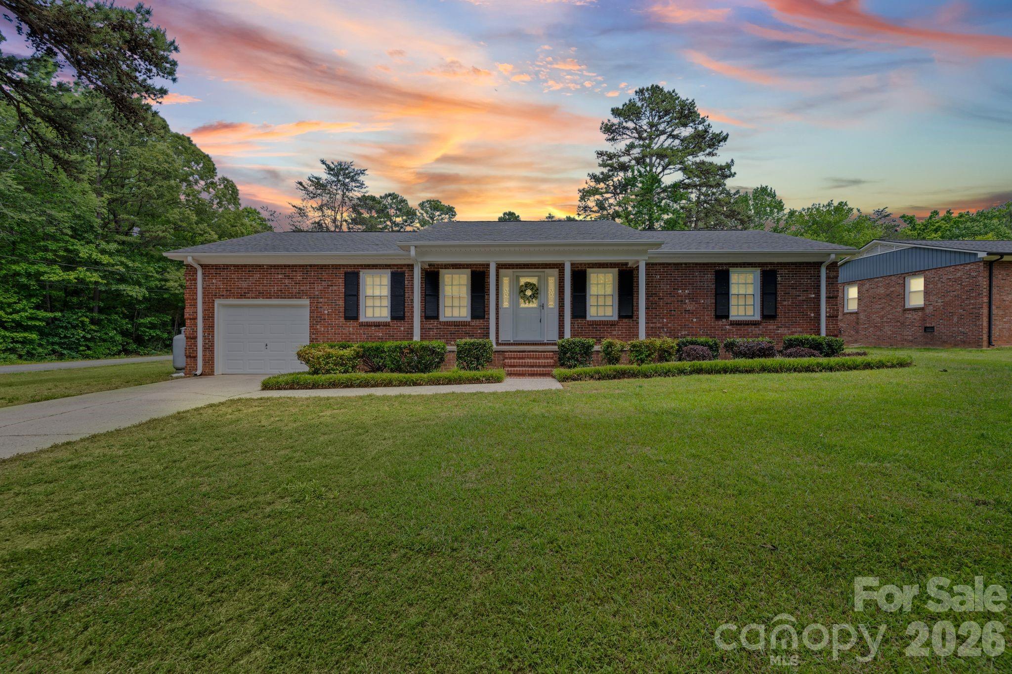 Come see this hard to find full brick ranch 3bed/2full bathroom home sitting on an oversized lot w/ a 3 bay detached fully conditioned garage/workshop! The home features an expansive open floor plan as soon as you walk in the front door providing a large family room, dining area, breakfast island and updated galley kitchen. The property comes with a propane fed Generac generator, powered by two above ground tanks, as a luxury to have and not need, than to need & not have! Conveniently located in Bostian Heights Subdivision w/ no HOA and only 2.5 miles from I-85 exit 68.