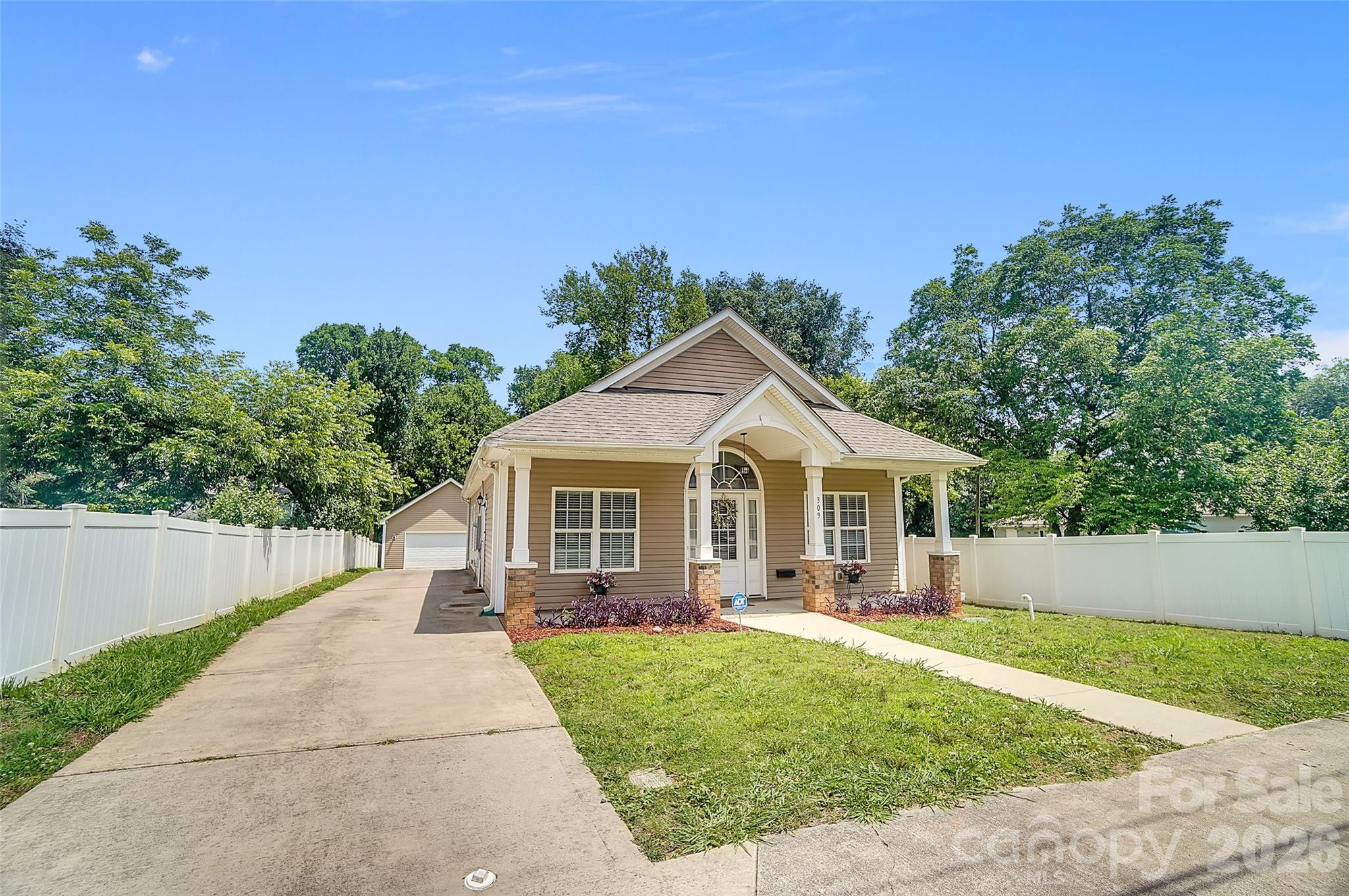 Welcome home to this beautifully maintained 3-bedroom, 2-bath. home located in Highly sought-after Historic Biddleville is just minutes from Uptown Charlotte, breweries, restaurants, parks, greenways, and the Lynx Gold Line. As functional as it is beautiful, this home is a must see for anyone looking for the perfect place to entertain in close proximity to the finest dining, shopping, and nightlight Charlotte has to offer. Truly Urban living at its finest  From the inviting front porch to the spacious fenced backyard, this property is designed for easy living and entertaining.

The well-appointed kitchen features granite countertops, stainless steel appliances, a stylish tile backsplash, upgraded 42-inch cabinetry, and a convenient breakfast bar that opens to the main living areas. Hardwood flooring flows throughout the primary living spaces, creating a warm and elegant atmosphere.

Enjoy multiple gathering spaces including a formal living room, dedicated dining room, and a spacious family room highlighted by a soaring vaulted ceiling. The private primary suite offers a vaulted ceiling, walk-in closet, and sliding glass doors that provide direct access to the deck—perfect for enjoying your morning coffee or relaxing in the evening.

Additional features include blinds throughout, generous storage, and an HVAC system that is only two years old and equipped with a whole-house media filter for enhanced comfort and air quality.

Outside, you'll find a detached two-car garage, an extended driveway with ample parking for multiple vehicles, and a fully fenced backyard with  vinyl fencing. The expansive yard space behind the garage provides endless possibilities for outdoor activities. Priced to sell and offering exceptional value, this home presents a rare opportunity to own in a neighborhood where comparable homes have recently sold for significantly more. Buyers will appreciate the combination of features, space, and competitive pricing, making this one of the best values currently available. Don't miss your chance to secure a home with instant equity potential in a highly desirable location.