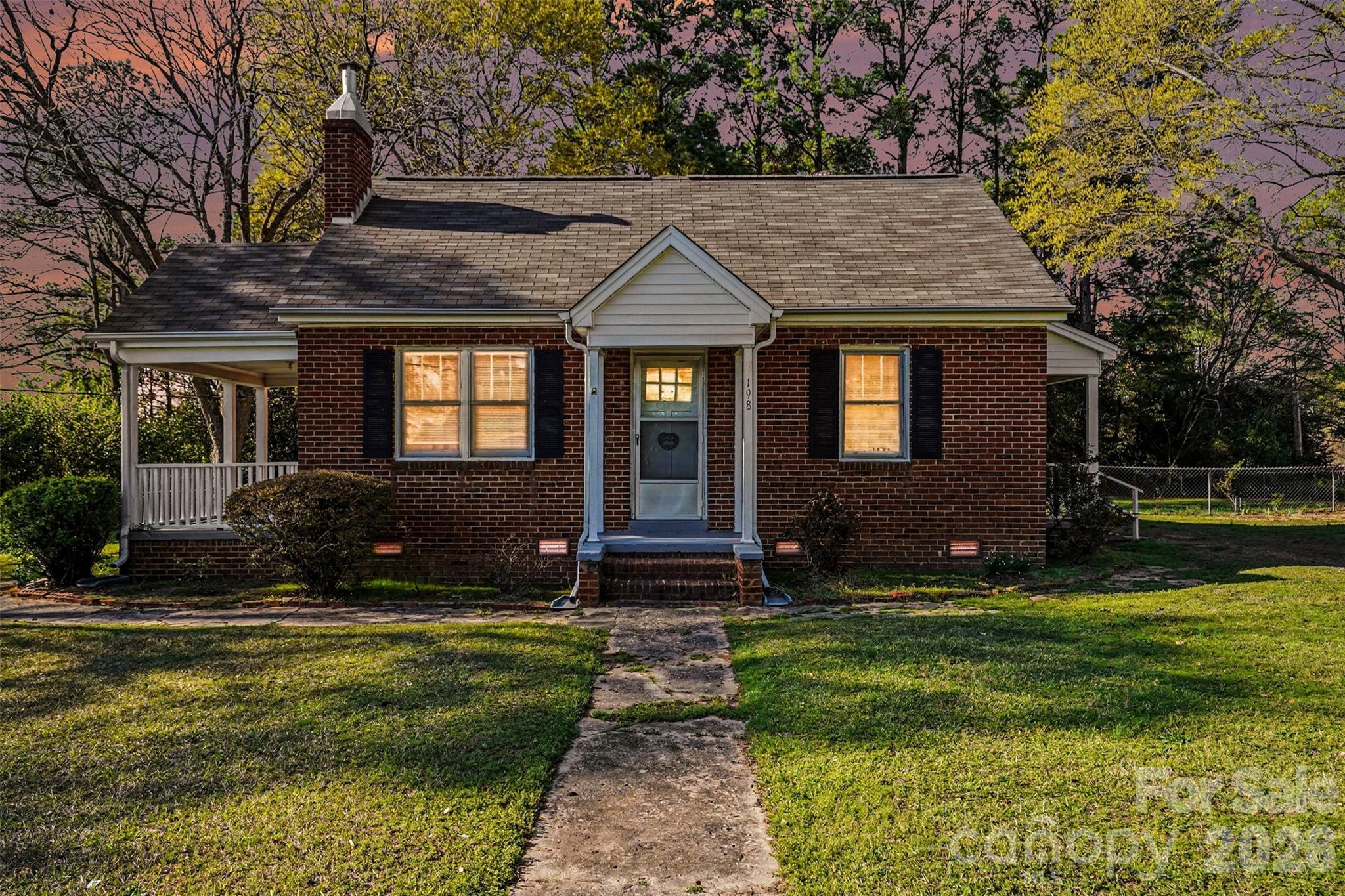 Full of character and opportunity, this classic 3-bedroom, 1-bath brick ranch has been owned by the same family since 1900's. Situated on a large, fenced double-parcel lot, the property offers plenty of space and flexibility—whether you're looking for an investment property or a home to update and make your own.

A covered side porch provides the perfect spot for rocking chairs and relaxing afternoons. Inside, the living room features a fireplace with gas logs and a blower, creating a cozy gathering space. The home includes four bedrooms and one full bath, offering a practical layout with room to personalize.

Out back, you'll find a double storage shed with power, ideal for a workshop, hobby space, or additional storage. Conveniently located in Rock Hill, the property offers quick access to shopping, dining, and major routes, making it easy to get around town or commute toward Charlotte.

Being sold as-is, this property is ready for its next chapter!