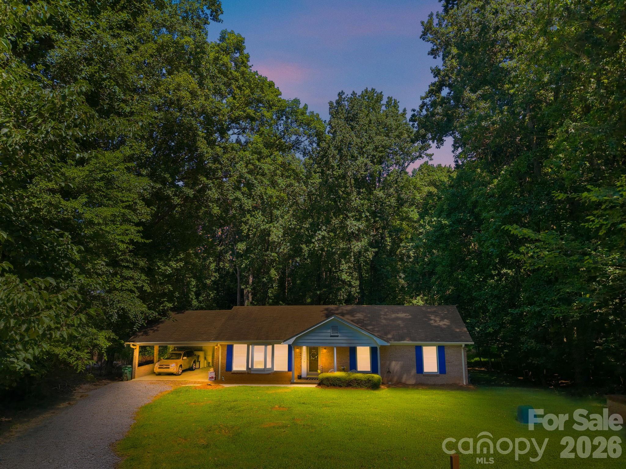 Welcome home to your full-brick ranch. Nestled on just over half an acre in a mature community with NO HOA. This home offers an open floor plan featuring a cozy sunroom and is priced for you to make it your own. There are three spacious bedrooms, two full bathrooms, a covered carport and a storage shed (ride-on mower conveys). The sunroom overlooks the large, private backyard. Property is being Sold “AS IS” by family members. Enjoy quick access to I-485, minutes to Steven's Creek Nature Center & Preserve and zoned for a top-rated elementary school. Close proximity to Mint Hill shopping and dining, and a convenient commute of less than 30 minutes to Uptown Charlotte!