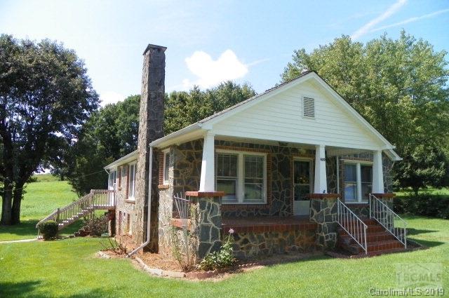 Rock Bungalow features three bedrooms, living room with gas fireplace, dining room, kitchen/breakfast, bath, sunroom. Refinished hardwood floors, smooth ceilings, new bath. Minutes from downtown Morganton, Broughton Hospital, Carolinas HealthCare System Blue Ridge-Morganton, J. Iverson Riddle Developmental Center, restaurants, grocery store, I-40.  Room for garden. Vinyl under eaves. Seller providing one-year home warranty.