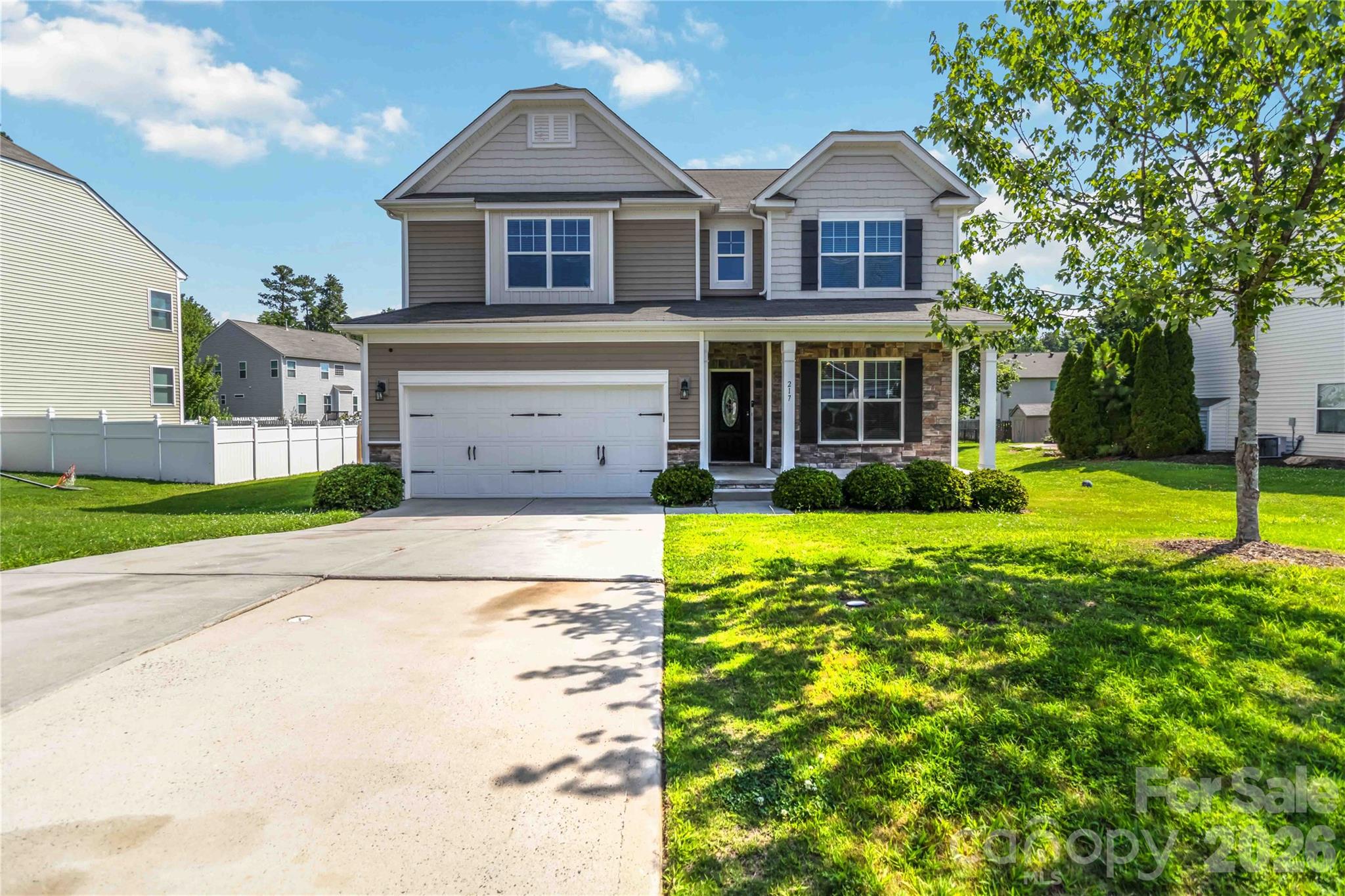 Beautifully designed home offering approximately 3,150 heated square feet of comfortable living space with five bedrooms and four full bathrooms. The flexible floor plan includes a main-level guest bedroom and full bath, while the open-concept living area seamlessly connects the kitchen, dining, and gathering spaces for everyday living and entertaining. The kitchen features granite countertops, stainless steel appliances, a breakfast bar, abundant cabinetry, and elegant crown molding. Upstairs, you'll find generously sized bedrooms, well-appointed bathrooms, and ample storage. Situated on approximately .29 acres with an attached two-car garage, this home is located in the Somerset at Autumn Cove community, which offers a neighborhood pool. Conveniently located near shopping, dining, Lake Wylie, and everyday amenities, this home is ready for its next owner. Schedule your private showing today!