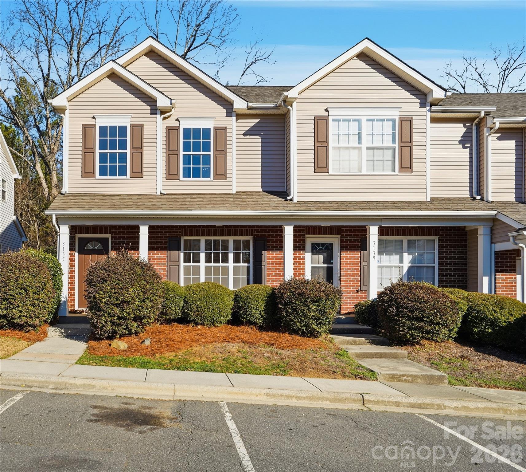 Beautifully updated 3 Bedroom, 2.5 bath end-unit townhouse backing to wooded privacy!  This move-in-ready home features numerous recent upgrades, including durable LVP flooring, all-new carpet, fresh interior paint, new light fixtures, new kitchen appliances, and granite counters. The large living room offers a cozy fireplace and plenty of space for entertaining. The bright, open kitchen flows seamlessly into the dinning area, creating an inviting space for everyday living. All bedrooms are generously sized with ample closet space. Enjoy outdoor living on the private patio and the convenience of an attached storage room. Conveniently located near I-485, UNC Charlotte, Concord Mills, dining, shopping, and entertainment.  This property qualifies for 100% financing with no PMI and $20,000 in lender assistance for the following:  Closing costs, rate buy down, and loan amount reduction.