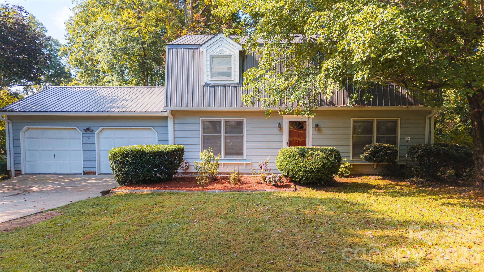 Move right in to this 3BR 2.5Bath 2 story farmhouse w/approx 2700sf of heated living space. Home features many updates in recent years like new metal roof, granite countertops in kitchen w/stainless steel appliances, large living room w/wood burning fireplace, freshly painted inside, new vinly plank flooring and large 24x24 garage on main floor. Upstairs offers 3 bedrooms including large owners suite w/double vanity and large walk in tile shower. Home also offers full basement great for den/family room and or work out area. All this and only minutes to downtown Morganton or beautiful Lake James.
