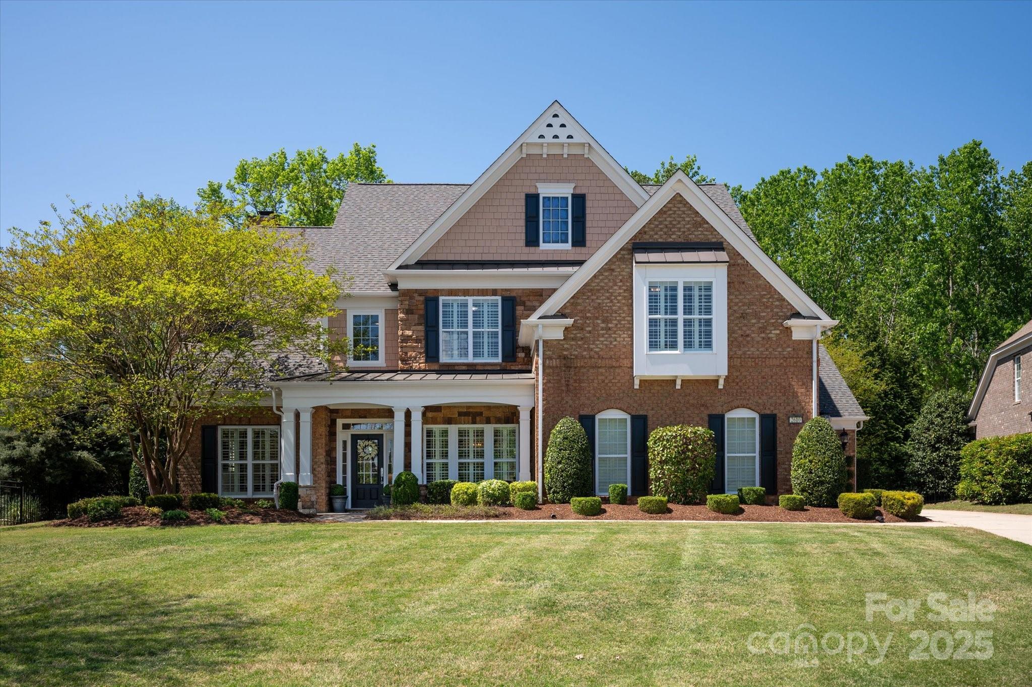 Beautiful 3 story Thurleston model in The Chimneys of Marvin with over 4,400 sq ft of living space. Extremely private lot that is wooded and features a custom patio with pergola, built-in grill and large fireplace with side walls and beautiful stone work. Wide plank wood flooring throughout 1st floor. Office with fireplace, vaulted ceiling and lots of light. Ist floor guest suite with dedicated full bath. Open concept chef's kitchen & great room with an additional fireplace. Stainless steel appliances, large eat-in island, granite counters and an abundance of cabinetry. 2nd floor features primary suite with sitting area, tray ceiling, spa-like bath & large walk-in closet. 3 additional bedrooms (2 of which are jack n jill) and bonus complete the 2nd floor. Spacious 3rd floor w/dedicated full bath and additional storage.  Plantation shutters throughout. 3 car garage. Close to neighborhood amenities and Sandy Ridge Elementary. Award Winning Marvin Schools.