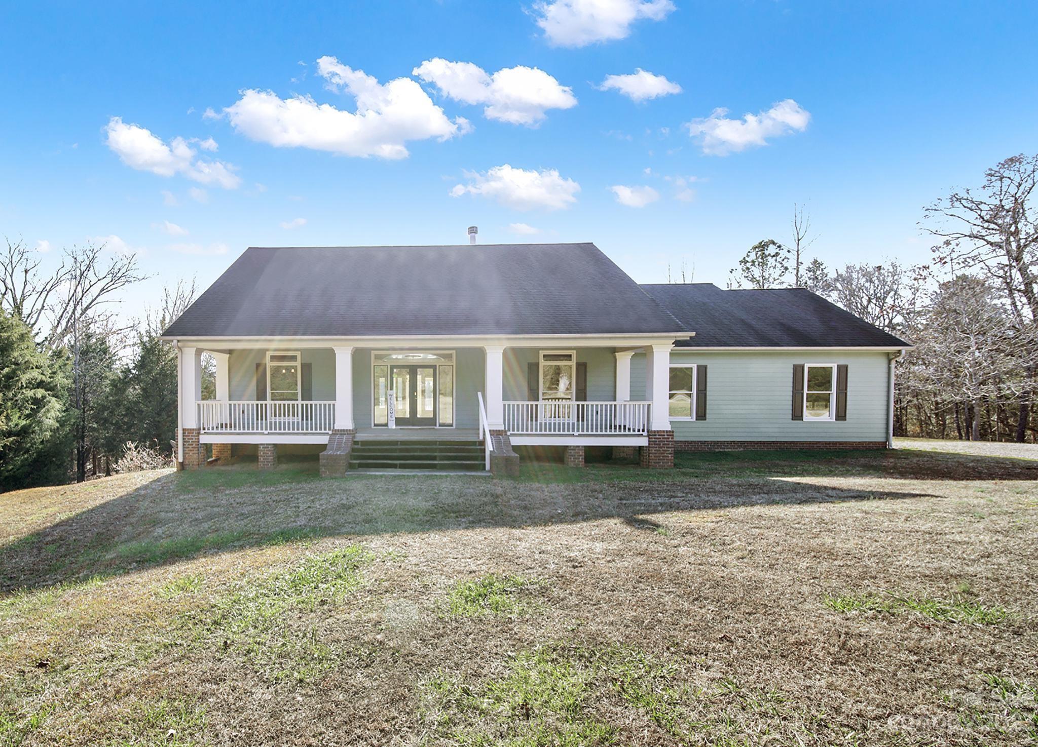 Welcome to your serene ranch-style retreat on 6.86 acres, just 5 minutes from the highway. This 4000 sq ft residence exudes exceptional craftsmanship and functionality, surrounded by nature with no HOA, second living quarters, and a full basement.

The main residence is thoughtfully designed for seamless daily living, featuring natural wood floors, large kitchen and laundry rooms, and a spacious primary suite all flooded with natural light. Multiple decks and balconies offer breathtaking views, while ample storage keeps the home organized.

Discover added versatility with a second living quarter in the basement—complete with a separate entry, kitchen, laundry, a workshop, and more. Perfect for in-law suite, rental, or Airbnb income.

Built to last with 9-inch poured concrete, rebar support, and steel beams, this home is a durable sanctuary. Don't miss the chance to embrace tranquility, potential income, and impeccable design. Schedule a showing to make this dream oasis your own.