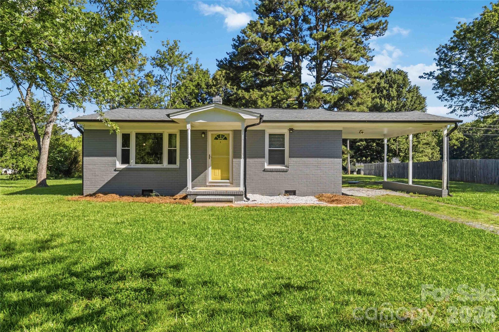 Don't miss this move in ready ranch home on .73 +/- acres!!! Great starter home or perfect for downsizing! Updated and well-maintained! Large back yard with deck. Plenty of parking and has attached carport!! Kitchen has farmhouse/apron sink, newer cabinets and countertops! Previous owners had the well disconnected and connected the home to county water. Painted exterior brick. Book your showing today!