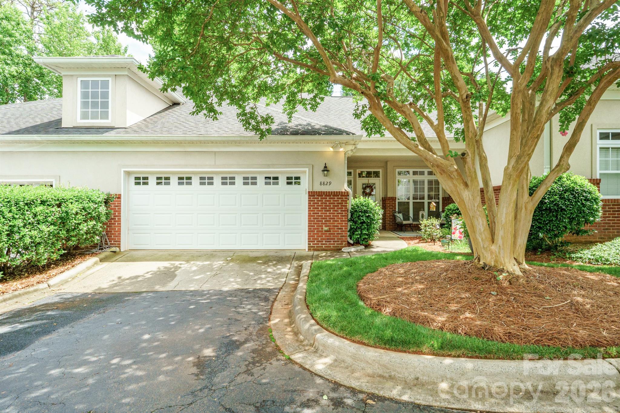 Welcome Home! Enjoy a spacious 1 story, 3 bedroom 2.5 bath condo with exceptional 9' ceilings and large windows throughout. All windows are provided with custom blinds. The large living room comes with a new gas fireplace and vaulted ceilings, beautiful hardwood floors as well as well maintained carpet in two of the bedrooms, hardwoods in the other. This home offers a split bedroom floor plan with a jack and jill bath. The master bath offers an en-suite with a stand alone shower and bathtub. The kitchen has been upgraded with white cabinets throughout. Outside you'll enjoy a covered front porch and back patio that has been extended by brick where a dining table can be set up. Ceiling fans run throughout this home. . Just steps away to Davis Lake pool and amenities, as well as shopping and dining at The Shoppes at Davis Lake. This home won't last long
