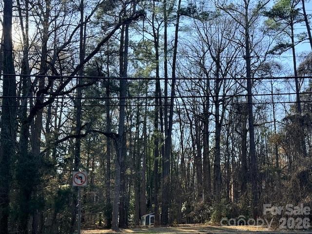 Build your dream home on this rare Near 1/2 acre lot in the heart of Charlotte. Rare opportunity to own a beautiful ~½ acre homesite on Sardis Road in one of Charlotte’s most desirable and established areas. Lot 1 is a private corner lot measuring approximately 90’ x 237’, offering exceptional space, mature landscaping, and a natural tree buffer that provides both beauty and privacy from the road.

**Neighboring Lot is available also to create a massive 1 acre lot***

The lot features a gentle slope, giving buyers the flexibility to design a home with or without a basement depending on their vision. With no HOA and the freedom to bring your own builder, this property offers the rare combination of location, flexibility, and privacy that is increasingly difficult to find in Charlotte.

Ideally situated within walking distance to several of Charlotte’s top private schools, the homesite is surrounded by established neighborhoods and luxury homes.

Whether you’re ready to build now or planning your future dream home, this property provides the perfect canvas. We are happy to help guide buyers through the building process and connect them with respected local builders in the Charlotte area if desired.

Most buyers interested in land want to know three main questions: 1. What is this house going to cost me in total for the land and house?  2.How long does it take to build? 3.How do I finance a new construction home? 

1. Knowing what the land and home is going to cost you 'all in' ... "It depends"... It depends on what size house you want, what finish level you want for the house and how elaborate you want the exterior. Depending on what you want, it is reasonable to expect that the all-in home build and land price to start around $1.3M. To more than $3M. A home built right behind this home appraised for just over $3M - Because there is No HOA you can contract with a more production builder and build an extremely well valued home and be on the lower end or if you prefer more of a custom build you can certainly do so and the price can realistically cost $1.7M-$2.3M+
2. Timeline can vary on the complexity of the build. It is safe to expect roughly 9 months on the short end for a more production based builder and more than 16 months if you go more custom. 
3. We are more than happy to connect you with a lender who specializes in construction loans and they can discuss all the options they have. 

Building on your lot is easier than you may imagine, We are experts in new construction and 'building on your lot' and are more than happy to have a call with you, walk you on the land and show you all the options there are in the market for you to get your dream home in your budget.