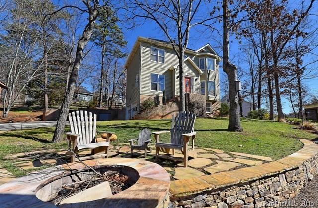 Updated 2 story home with a seasonal view of Beautiful Lake Wylie. Contemporary kitchen with Stainless Steele appliances. Nice cabinetry and hardwood floors. Finished basement allows for office or study. Master features private balcony. perfectly manicured, fenced yard with stone fire pit.