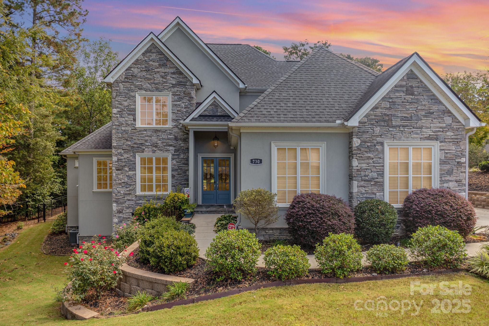 Back on Market at no fault of the seller! 
Welcome to Peaceful 730 Spyglass Way! YES, IT'S ON THE GOLF COURSE!
This stunning custom home on 0.45 acres in Waterford Glen offers a rare combination of serenity and convenience. From the backyard, enjoy a one-of-a-kind view of the 12th hole of the Waterford Golf Course, creating a picturesque backdrop that sets this property apart.
The gorgeous stacked stone and hard stucco exterior exudes timeless elegance, while the thoughtfully designed interior takes open concept living to the next level. The natural light streaming through the numerous oversized windows brighten each space naturally! The kitchen boasts a plethora of white cabinets, stainless steel wall oven/microwave, refrigerator, dishwasher and gas cooktop! The kitchen also has plenty of space to sit at the breakfast bar or add a table for a casual eat-in kitchen experience. The separate dining room has windows overlooking the fenced-in backyard and golf course. The spacious living area has an amazing contemporary gas wall fireplace to warm chilly evenings and create a relaxing ambiance. The primary suite boasts high ceilings, plenty of room for large furniture pieces and it's own bathroom suite. Massive shower, full wall vanity with 2 sinks, separate water closet and walk-in closet provide an aesthetically pleasing visual and relaxing spa-like getaway!
Unwind year-round on the screened-in porch or entertain on the paved patio within the fenced backyard, where you can listen to birds singing and watch them flit from tree to tree. Also enjoy the golfers and people watching as they play the 12th hole. The sliding door out to the screened-in porch stacks on itself creating a large entry area.
A private office area with french doors is perfect for working from home or keeping things in their place! Built-in cabinetry provides more storage to hide many office supplies. 
Upstairs you'll find two more private bedrooms and a shared bathroom with dual-sinks, tub/shower combo and linen closet. A custom closet system was built from a portion of the attic with storage that is unmatched! It does not have it's own vent, however, leaving the door open works to keep it at room temperature.Other walk-in attic areas are accessible from upstairs!  
Waterford Glen offers the best of both worlds—a tranquil, welcoming community that’s just minutes from Rock Hill’s finest shopping, dining, and conveniences. In the summer, enjoy the community pool, a perfect place to cool off, connect with neighbors, and soak up the outdoors. DON'T MISS THIS ONE!