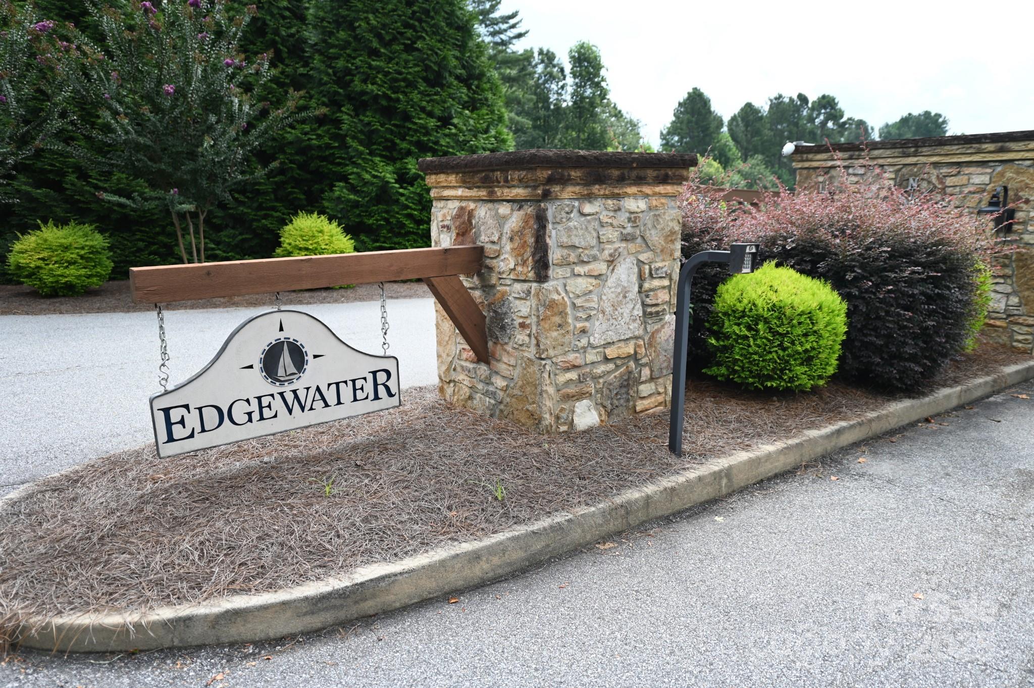 Lakefront 3+ acre lot in Edgewater at Lake Rhodhiss, offering privacy, luxury, and natural beauty. Build your dream home or retreat in this gated lakefront community with private amenities—covered pavilion, fire pit, and picnic area—just a short walk from the property. Conveniently near Hickory, Morganton, and Lenoir, enjoy easy access to shopping and dining while maintaining a peaceful, secluded lifestyle.