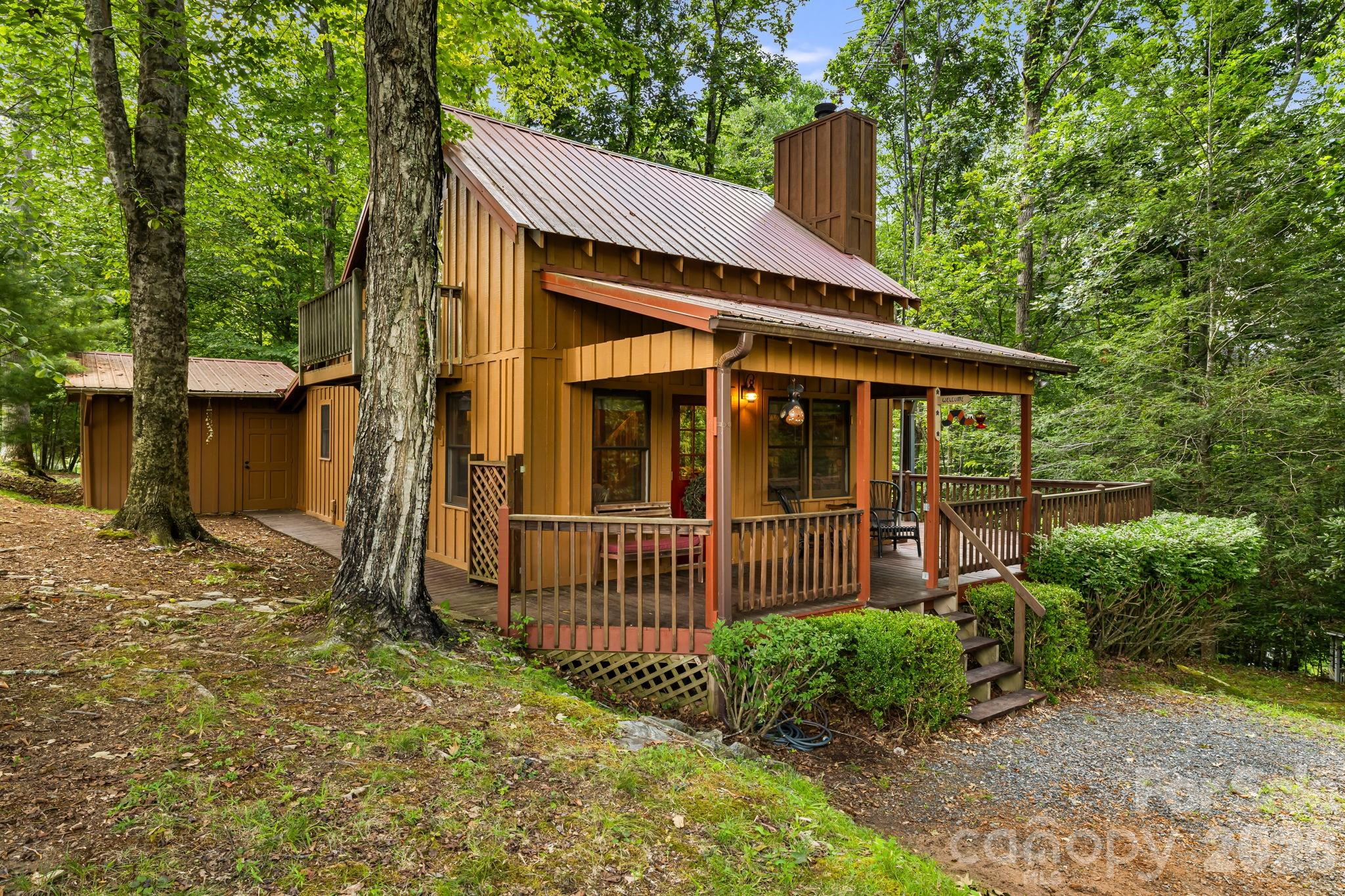 Unrivaled tranquility awaits at this stunning, fully furnished mountain log cabin. Nestled in an exclusive residential enclave free from transient rental traffic, this property offers a true permanent sanctuary or multi-generation legacy retreat. Features warm wood interiors, a stone fireplace, and a versatile basement with a private entrance and a dedicated workshop. Fully turnkey and sold furnished—avoid the cost and hassle of moving furniture up the mountain; just bring your toothbrush and your outdoor gear. Enjoy deeded access to the North Toe River for world-class fishing and kayaking.