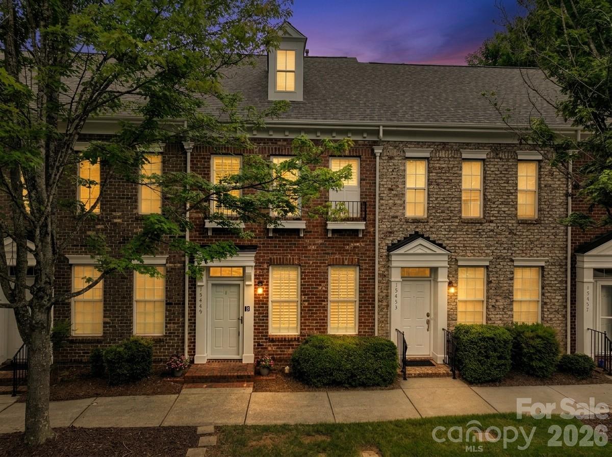 All-brick townhome in the heart of sought-after Monteith Park! A warm, landscaped entry opens into a bright main level where tall ceilings and plantation shutters let natural light pour into the family room, anchored by a cozy gas log fireplace. The open floor plan flows easily into the dining area and a well-appointed kitchen with ample counter and cabinet space and a breakfast bar. A convenient half bath rounds out the main floor. Upstairs offers a flexible dual primary suite layout — two generously sized bedrooms, each with its own full bath, walk-in closet, and brand new carpet for a fresh, move-in-ready feel. A walk-in pantry adds everyday storage. Outside, unwind on your private fenced patio before heading to your private parking.
Tucked along Monteith Park's tree-lined streets and pocket parks, this home puts you just steps from the community's extensive amenities: a large clubhouse, outdoor pool, playground, scenic walking trails, and a neighborhood park with benches and a water feature, plus the year-round events that give Monteith Park its sense of community. And with downtown Huntersville, Birkdale Village, Lake Norman, shopping, dining, and easy I-77 commuter access just minutes away, this low-maintenance townhome offers the best of both worlds — a peaceful retreat with everything you need close by. Welcome Home!
