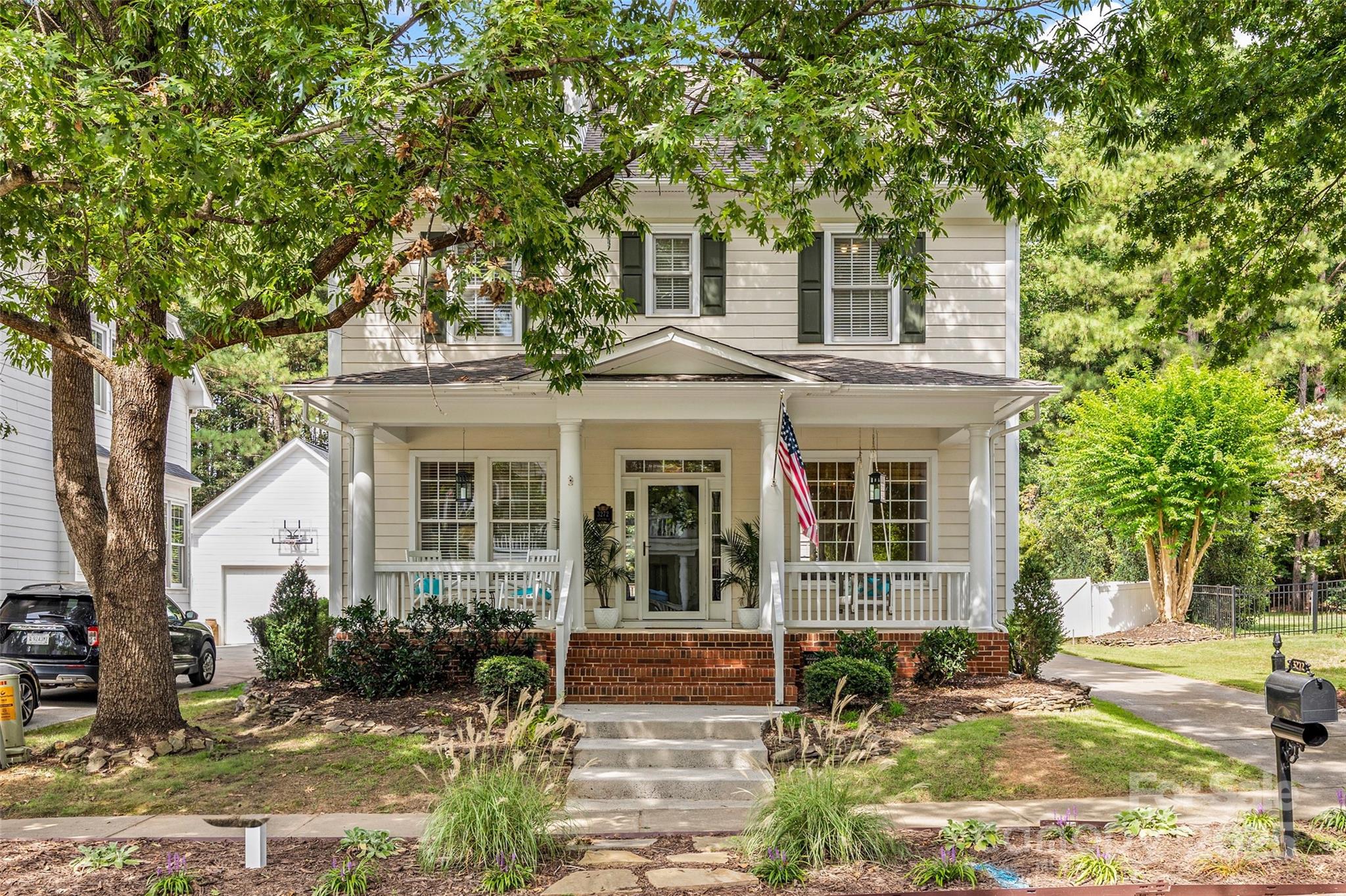 This classic two-story home with an inviting front porch is ready to meet you! As you step inside this home, you will see French doors that enclose a private office space and a formal dining room or a formal sitting room - your choice!  The open kitchen and living room is flooded with natural light and is a great space for family and friends to unwind, laugh, and share meals.  Outside, you will find a large deck with a built in space for a gas grill, a green space and a two-car detached garage all surrounded by a white fence.  Upstairs, there are 4 bedrooms including a primary suite with a bathroom with heated floors, a large custom closet, a walk-in shower and a soaking tub.  This home is not one you want to miss in charming Baxter Village.  From this special home to the wonderful amenities of this walkable community, your new home awaits!