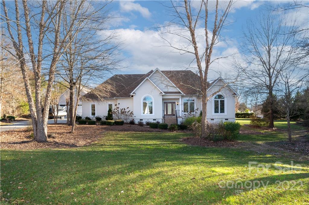 A unique and secluded home set on nearly one acre of land near Lake Wylie.  A very tasteful custom home meant to entertain.  From the beautiful outdoor bar and hot tub to the boat slip just a quick golf cart ride away it is sure to impress.  High ceilings throughout the home with an open concept makes the home feel very spacious.  The home has three bedrooms and a large bonus room with two skylights. It also includes a detached garage with a lift for your vehicles.  Almost everything has been upgraded on this home within the last two years.  Truly a one of a kind home.