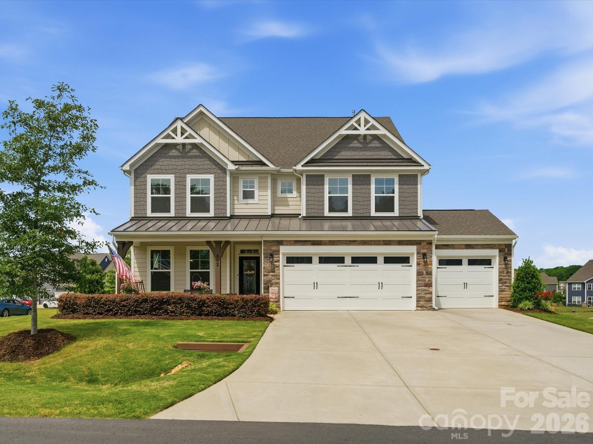 This gorgeous home has been meticulously maintained & waiting for you! Covered rocking chair front porch welcomes you. Dining room with tons of natural light with a butler's pantry featuring wine fridge & walk in pantry with custom built-ins. White kitchen has everything you need from an oversized island, farmhouse sink, gas cooktop, pot filler, pull outs in cabinets, soft close cabinets/drawers, pot drawers & more! Great room w/gas log fireplace is spacious and open to kitchen/breakfast. Tucked privately on the main floor is a guest bedroom with a nearby full bath, creating the perfect setup for visitors or a home office. Off the garage entry, you’ll find a convenient drop zone with built-in bench storage designed for everyday organization and a half bath. Upstairs, the spacious primary suite serves as a relaxing retreat with room for a sitting area, while the luxurious bath features dual vanities, a soaking tub, a separate shower, and an oversized walk-in closet w/built-is. The second floor also includes three additional bedrooms (sharing a jack-n-jill bath), a large loft ideal for a media room or playroom, and a centrally located laundry room with sink, window & cabinetry. Moving to the third floor you’ll discover another private bedroom and full bath ideal for teen suite, bonus room, office or flex space. Step outside to enjoy the screened porch overlooking the expansive patio and fire pit area, creating the ultimate outdoor entertaining space with this huge corner lot. The sunsets here are stunning!  Too many upgrades to list: tankless water heater, 3 car garage, upgraded carpet and pad throughout the home, spindle staircase & more!