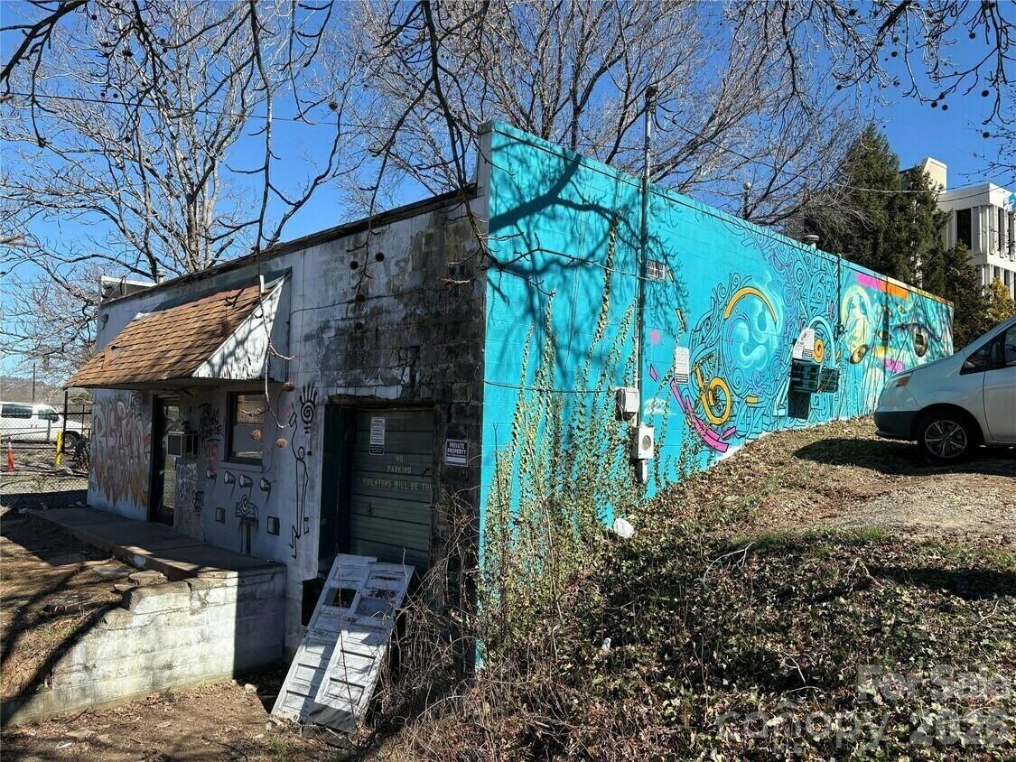 Great opportunity in downtown Asheville at the intersection of Woodfin and Broadway just behind the Lazy Diamond and 1/2 block from the 240 Connector. Owner financing a possibility at commercial lending rates. Block building with rollup door. A perfect empty slate for redevelopment. 0.15 Acre corner lot in the heart of the North Lexington Avenue district. Could easily be a great dive bar or food service or a small warehouse (or all of the above). A great long term hold.••Highlights••Perfect as an empty slate redevelopment project•Could be a great dive bar, restaurant, food service, small warehouse. Excellent location at the intersection of Woodfin and Broadway - multiple signalized intersections•1/2 a block from the 240 Connector. Located in the heart of the North Lexington Avenue district•A great long-term hold.