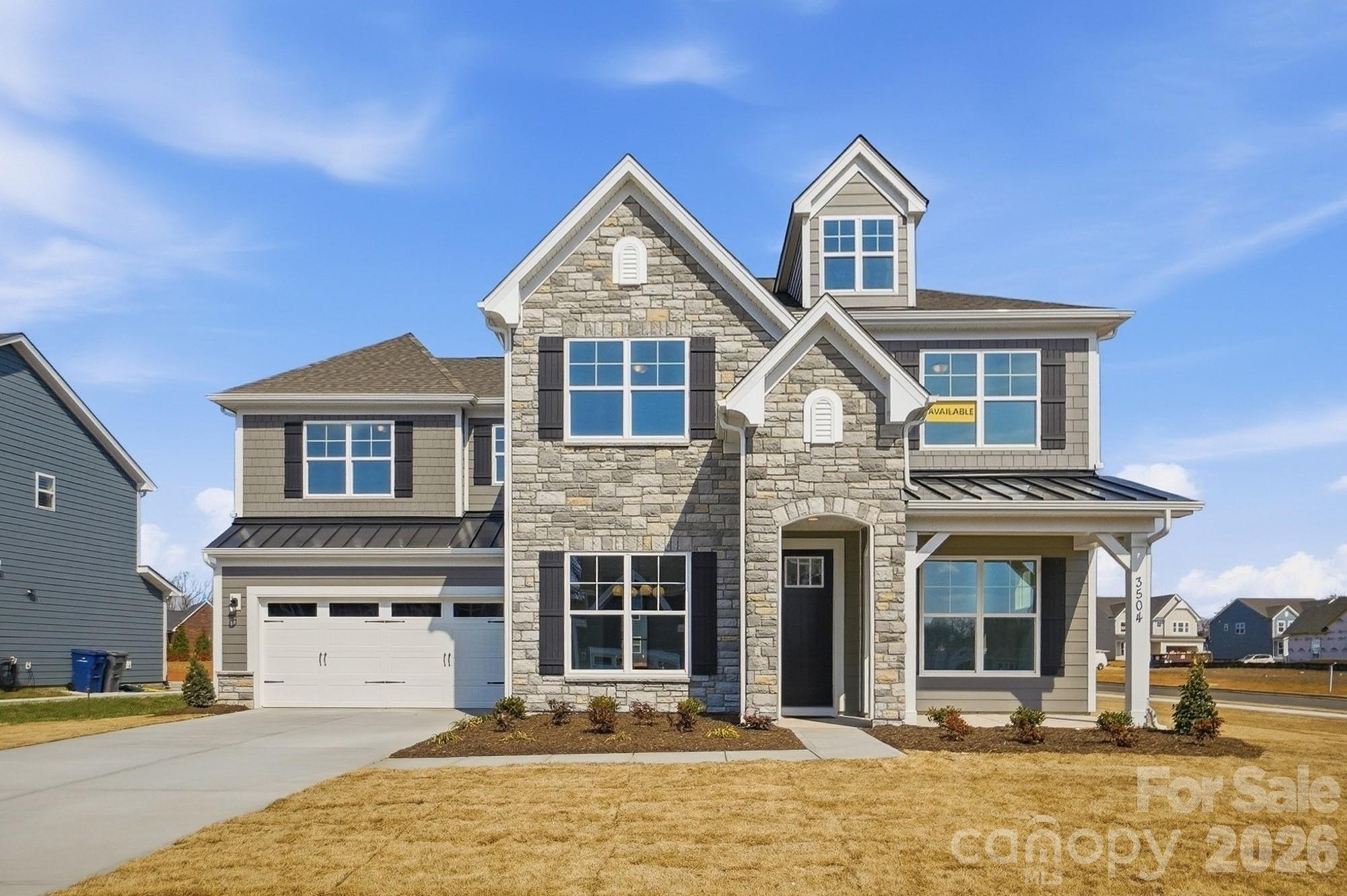 This Colfax plan is "SUITE!" The home offers 5 bedrooms (three with ensuite baths), 4.5 baths and more than 3,500 square feet of living space. The beautiful kitchen has white quartz counters, white cabinets with a contrasting dark grey island, tile backsplash, shiplap range hood, and stainless appliances, including a gas cooktop. This home also features a butler pantry with a wine cooler, formal dining room with tray ceiling, office with French doors and faux coffered ceiling, and family room with a Cosmo, direct-vent gas fireplace & shiplap feature wall. Enhanced Vinyl Plank (EVP) flooring is featured throughout the main floor and also in the loft and primary suite. The primary bathroom has a tub with tile surround and a tiled shower with bench seat & semi-frameless door. The main floor has a true guest suite with an ensuite bath that has a tiled, 4-ft shower. One of the upstairs secondary bedrooms also has an ensuite bath with a tiled, 5-ft shower. The upstairs hall bath has a tiled tub/shower combo. All baths have dark grey cabinets with white quartz counters. Other wonderful extras include 9-ft ceilings on the second floor, a rear covered porch, and laundry room with cabinets and sink. Visit today and make this home yours!