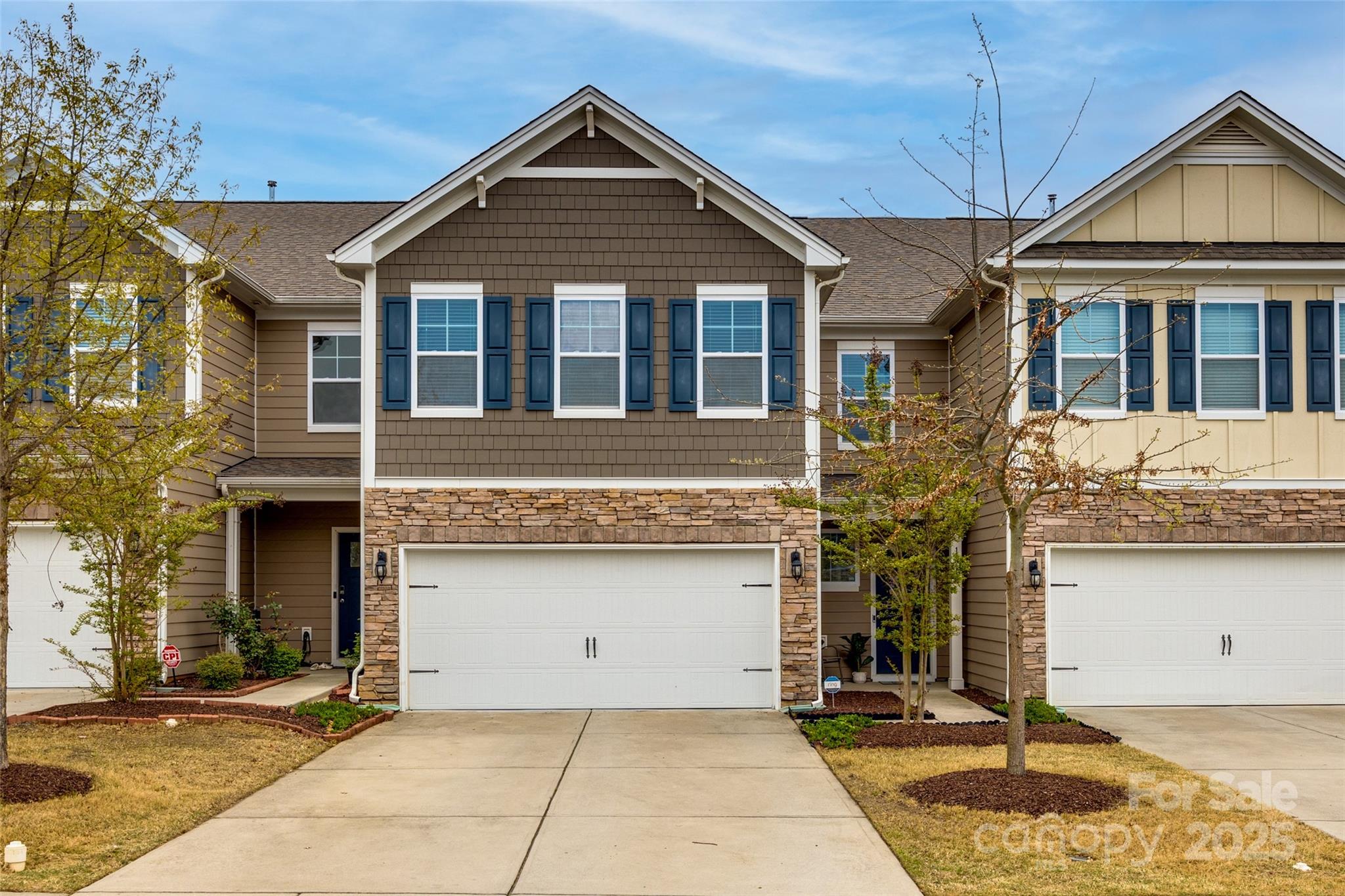 Welcome to this stunning 4-bed, 3-bath townhome in the highly sought-after Forest Grove community! Designed for modern living, this home features hardwood floors on the main level, featuring a bright open layout & guest suite w/full bath. The gourmet kitchen is a chef’s delight, boasting granite counters, SS appliances, gas range, pantry & spacious island—perfect for entertaining. Upstairs, LVP flooring enhances the stairs & primary suite, which features recessed lighting, walk-in closet & spa-like bath w/dual-sink granite vanity, soaking tub & tiled shower. Two additional bedrooms, a loft & laundry room complete the upper level. Addtl upgrades include recessed lighting in the loft & living area, a whole-house dual-stage water filter, ring security system, epoxy garage floor w/overhead storage & serene back patio. Fort Mill Schools!! Enjoy fantastic community amenities to include a pool, playground, & recreation area. Lawn maintenance included. Move-in ready—schedule your tour today!