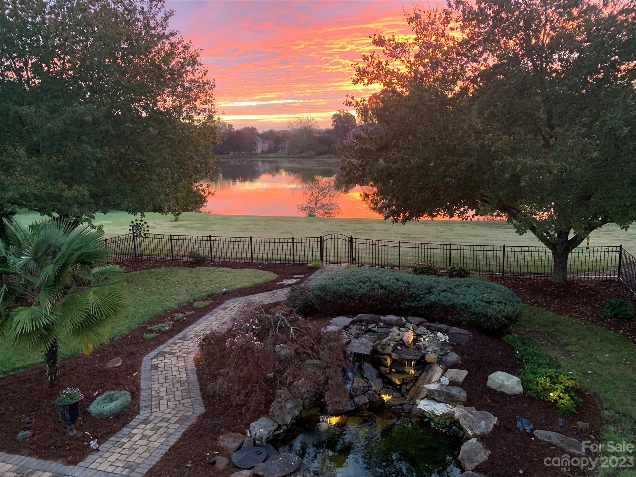 Amazing custom brick/stucco executive home with beautiful water views and sunrises in award winning Fort Mill School district AND quick access /location to I77.There is so much to appreciate about this lovey home. The grand entrance welcomes you in and main floor offers 2nd master bedroom for multigenerational living,open 2 story great room and wow kitchen with tons of counter space,all remodeled and butler pantry!Formal dining room and formal living room/flex space.The 2nd floor offers 3 bedrooms/2 bathrooms AND the luxurious master bedroom/bath suite that has a closet that does not end.It could be another room! On to the basement that is an entertainers delight.The theater room with stadium seating and projector, screen and surround sound that all remains.Custom wood bar anchors the other end of the huge space. You can make the space your own or possible mother in law suite with another full bath .Basement also offers 2 workshop rooms with venting for dust removal.Welcome home!!