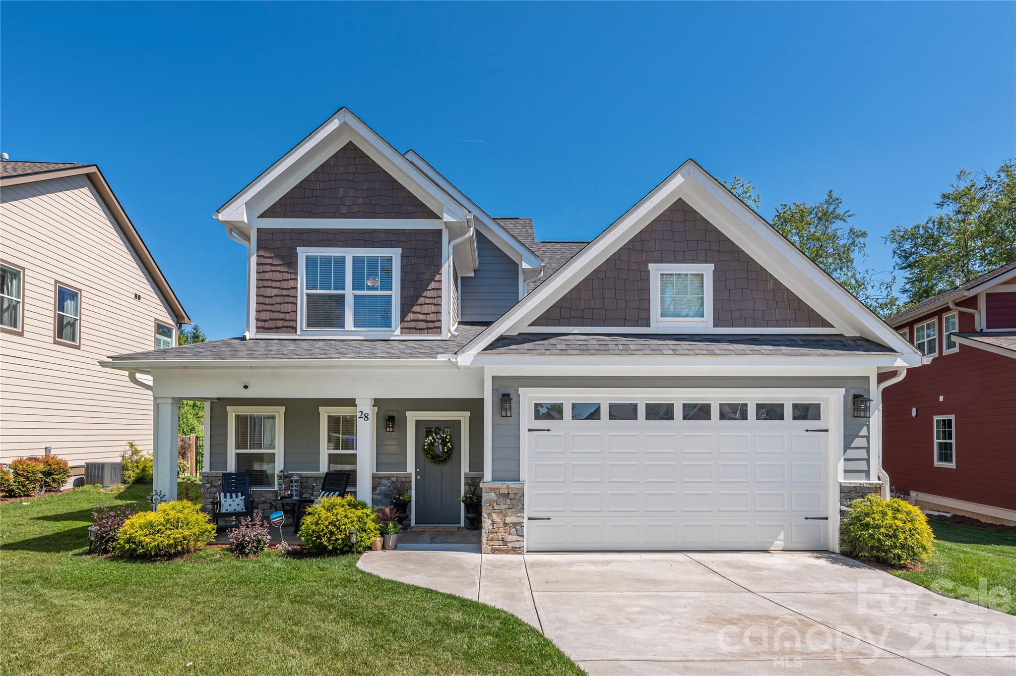 SOUTH ASHEVILLE'S BEST VALUE FOR A PRIMARY SUITE ON MAIN, NEWER CONSTRUCTION HOME, CUL-DE-SAC SETTING AND WALKABLE TO JACK RUSHER PARK!  Almost new and beautifully designed for both everyday comfort and effortless entertaining, this bright and open home in desirable South Asheville’s Legacy Park offers the perfect blend of modern style, flexible living, and convenience. Tucked away in a cul-de-sac and just walking distance to Jake Rusher Park, this thoughtfully designed two-story home features zoned HVAC and quality finishes throughout.
The inviting open-concept main level is filled with natural light and showcases luxury vinyl plank flooring, multi-level crown molding, trey ceilings, and a spacious living room centered around a cozy gas fireplace. The kitchen IS FABULOUS! and was designed with both function and gathering in mind, offering a large island with bar seating, 42-inch cabinetry, granite countertops, stainless appliances, and a generous walk in pantry.
The main-level primary suite provides comfort and privacy with a custom walk-in closet and well-appointed bath with double vanity and walk in shower with seamless glass doors. A spacious laundry room and convenient half bath complete the main level. Upstairs offers three additional bedrooms, full bath, and exceptional floored attic storage tucked into the upper-level eaves — a rare and valuable feature in newer construction.
Enjoy outdoor living from the covered front porch or rear patio, with the exterior wrapped in attractive fiber cement siding with stone accents. Additional highlights include a tankless hot water heater, attached oversized 2-car garage, functional floor plan, and excellent use of space throughout.
With its bright interior, flexible layout, modern finishes, and unbeatable South Asheville location close to parks, shopping, dining, and everyday conveniences, this home truly offers the complete package!
