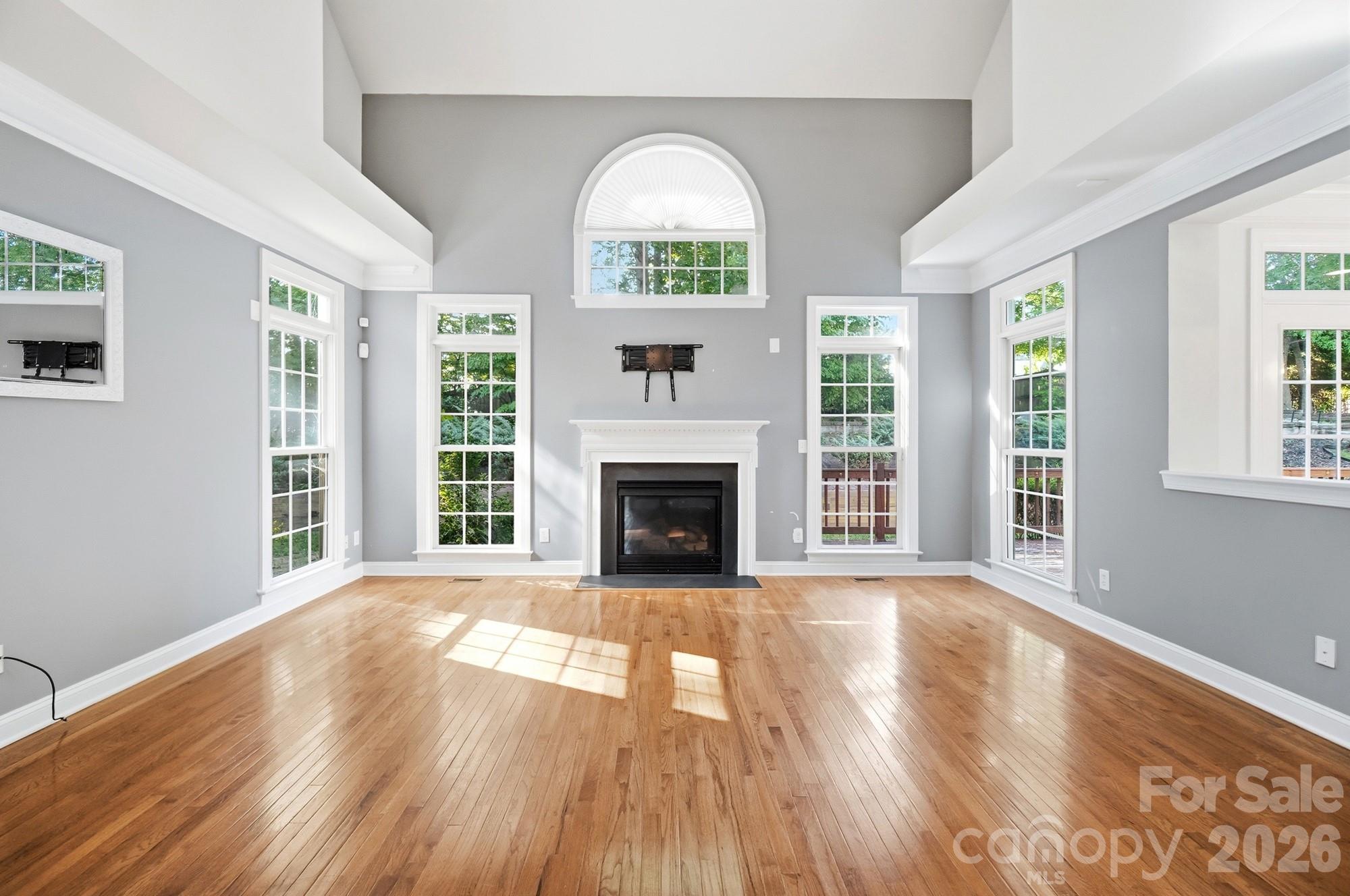 Welcome to this spacious Highland Creek home on the highly sought-after Cabarrus County side of the community. Offering over 3,400 square feet, this 5-bedroom, 3-bath home features a versatile floor plan with a main-level guest bedroom and full bath, dedicated office, formal dining room, large laundry room, and an expansive bonus room upstairs.

Sleep easy knowing major systems have already been updated, including a new HVAC system (2023) and tankless water heater, providing added comfort and peace of mind for years to come. The bright two-story great room with fireplace creates an inviting gathering space, while the well-appointed kitchen offers a gas range, double ovens, stainless steel appliances, updated backsplash, ample storage, and a sunny breakfast area.

Upstairs, the generous primary suite features a tray ceiling, walk-in closet, and spa-like bath with a soaking tub and dual vanities. Luxury vinyl plank flooring throughout the upper level adds both style and durability.

Enjoy outdoor living in the beautifully landscaped backyard complete with a large deck and paved patio, perfect for entertaining or relaxing. Located near Highland Creek Sports Club amenities, golf, pools, tennis courts, walking trails, Concord Mills, dining, shopping, and major highways, this home offers the perfect combination of space, convenience, and lifestyle.