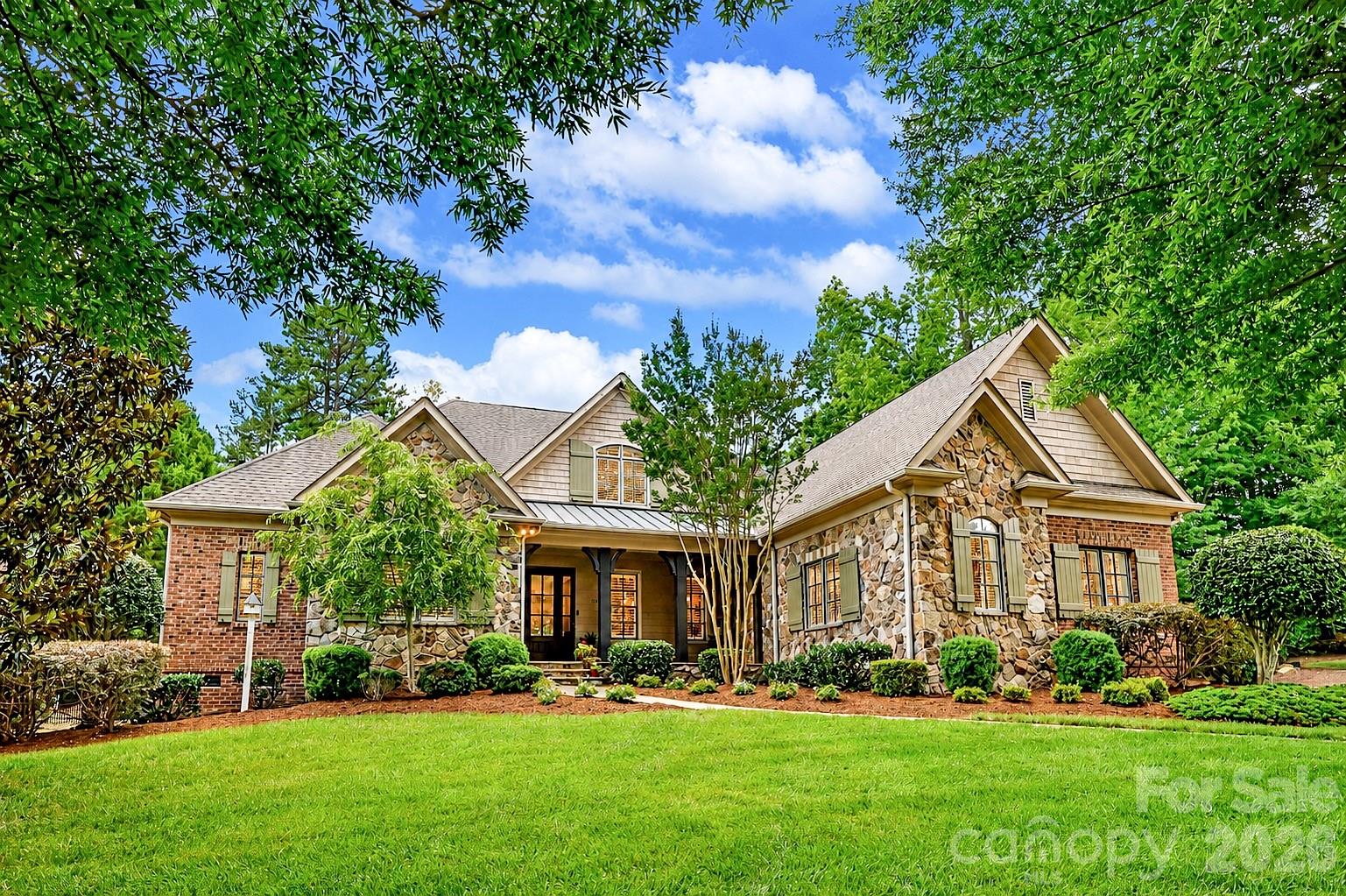 Steeped in timeless elegance and architectural distinction, this custom-built residence evokes the romance of an English country manor, where vintage chandeliers, intricate millwork, soaring coffered ceilings, and rich natural materials create a home of enduring beauty. This 5-bedroom, 5-bath home offers approximately 4,160 square feet with a luxurious primary suite on the main level. Heart pine floors, exposed wood beams, plantation shutters, custom window treatments, and exceptional craftsmanship throughout create an atmosphere of warmth, character, and enduring sophistication. The chef's kitchen serves as the centerpiece of the home, featuring a professional-grade Dacor gas cooktop, warming drawer, custom copper vent hood, sunlit breakfast room, and vaulted keeping room with wood beams anchored by a stacked-stone gas fireplace. Just beyond, the screened porch provides the perfect setting for morning coffee, remote work, or effortless entertaining. The living room showcases a coffered ceiling, custom built-ins, and a gas fireplace. Upstairs, each spacious secondary bedroom enjoys direct bath access, custom closets, while the bonus/bedroom also features a full bath, offering flexibility as a guest suite, media room, or additional bedroom. Outdoor spaces are equally inviting, with a covered terrace, built-in grill station, and wood-burning fireplace. Low-maintenance living thrives with professionally landscaped grounds, complete with irrigation and drip-line systems. Additional highlights include an epoxy-coated three-car garage, casement windows, recently replaced HVAC systems (2023 & 2025. Ideally positioned in one of Matthews' most desirable locations near the Charlotte line, residents enjoy convenient access to shopping, dining, recreation, and major commuter routes, along with the benefit of lower Matthews taxes. For those seeking exceptional educational options, some of the area's most sought-after public and private schools are just minutes away. Please check out the virtual tour! Don't miss the drop zone with hidden storage drawers and ample storage space in 2 attics.