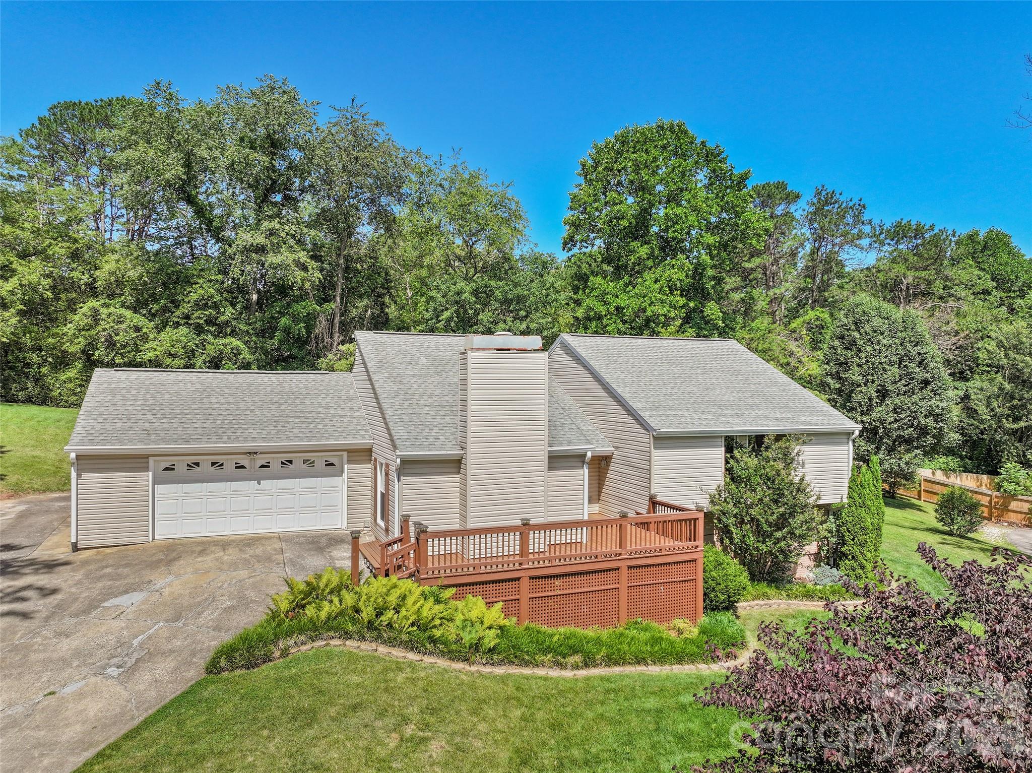Welcome home to 519 Nellie John Drive, a beautifully updated residence tucked into the desirable Dogwood Acres neighborhood of Clyde. Surrounded by peaceful countryside, mature landscapes, and nearby pastures, this move-in-ready home offers the perfect blend of comfort, style, and convenience.

Step inside to find a warm and inviting interior featuring updated finishes, engineered wood flooring, neutral tones, modern interior doors, and a thoughtfully designed layout ideal for everyday living and entertaining. The renovated kitchen showcases rich cabinetry, beautiful countertops, stainless steel appliances, a spacious island, and a breakfast bar.

The living room is the heart of the home with vaulted ceilings, abundant natural light, and a cozy gas log fireplace with a brick surround. With just a few steps up you will find a comfortable primary suite with a walk-in closet and updated bath featuring a walk-in shower, along with additional bedrooms and another full bath.

The lower level provides even more flexibility with a finished den, third full bath, hobby/storage space, and easy outdoor access. Enjoy the outdoors from the fenced backyard, perfect for pets, gardening, or relaxing in the peaceful mountain setting.

Located just minutes from downtown Clyde, Waynesville amenities, and an easy drive to Asheville, this home offers the convenience of town living while maintaining the quiet charm of Western North Carolina. A wonderful opportunity to enjoy updated living in a welcoming community.