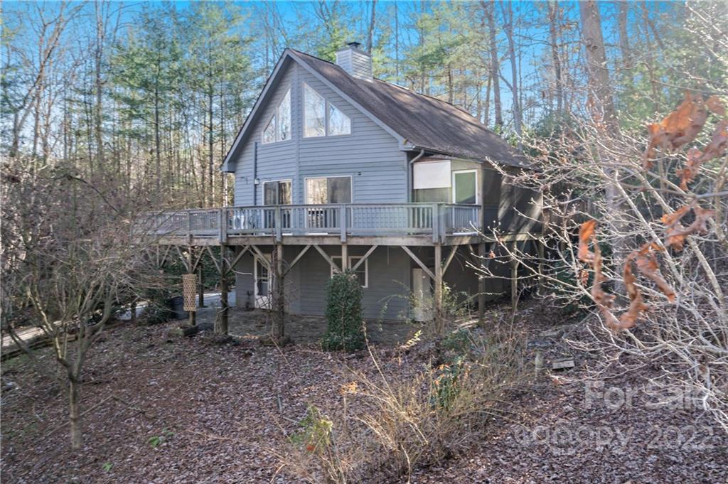 PRICE REDUCTION AND BACK ON THE MARKET!! A private and quiet location. Unique home with a bedroom and bath on each floor. Lower level has a full kitchen including dishwasher. Upper level has an en-suite bathroom and loft that would be a great office space. The wood burning fireplace on the main floor family room will keep you cozy during the colder months. Over 30K in repairs have been completed on this property which includes a retaining wall, structural deck components and other items.