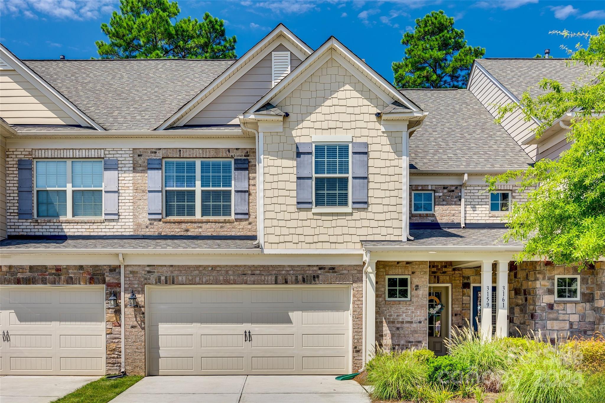 This is a lovely townhome in the wonderful Bridgemill neighborhood filled with amenities and in a great location close to commons shops at the front of the neighborhood. The Palomino floor plan offers a great open concept layout on the main level with the kitchen overlooking the dining area and spacious living room. There are beautiful dark hardwoods throughout the main level that continue up the stair treads. Upstairs is the large Primary Bedroom with Tray Ceilings, a huge walk-in closet, and the Primary bathroom with a fully tiled walk-in shower and dual vanities. There are two additional bedrooms that share a secondary full bathroom and the laundry room upstairs. Head outside to the lovely patio space with great privacy and great sized flat yard that backs up to mature trees in the HOA buffer. This home also faces the green space in the middle section of the complex. This home is in immaculate condition, don't miss out!