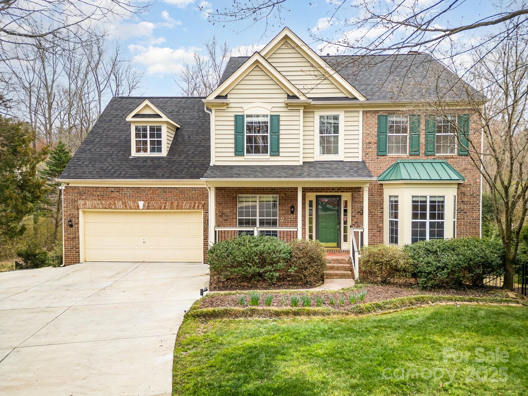 RARE FIND: Beautifully renovated 5 bed, 3.5 bath home with basement and pool in the award-winning Fort Mill School District. The main floor boasts hardwood floors, neutral paint and a spacious open concept layout. The updated kitchen features an oversized island, granite countertops, stainless steel appliances, and custom cabinetry. The family room has a cozy gas fireplace and custom built-ins, while the dining room and living room are perfect for entertaining. Relax and unwind upstairs in the primary suite with vaulted ceiling, huge walk-in closet and stunning spa-like bath. Three additional bedrooms, full bathroom, loft, and dream laundry room complete the second floor. The basement is equipped with a large rec room, dry bar, bedroom, full bathroom and flex space - ideal for hosting guests. Enjoy the serene outdoor setting of the wooded backyard with gunite pool, screened-in porch, deck, hot tub and covered outdoor space.  Oversized 2-car garage and mudroom...this home has it all!