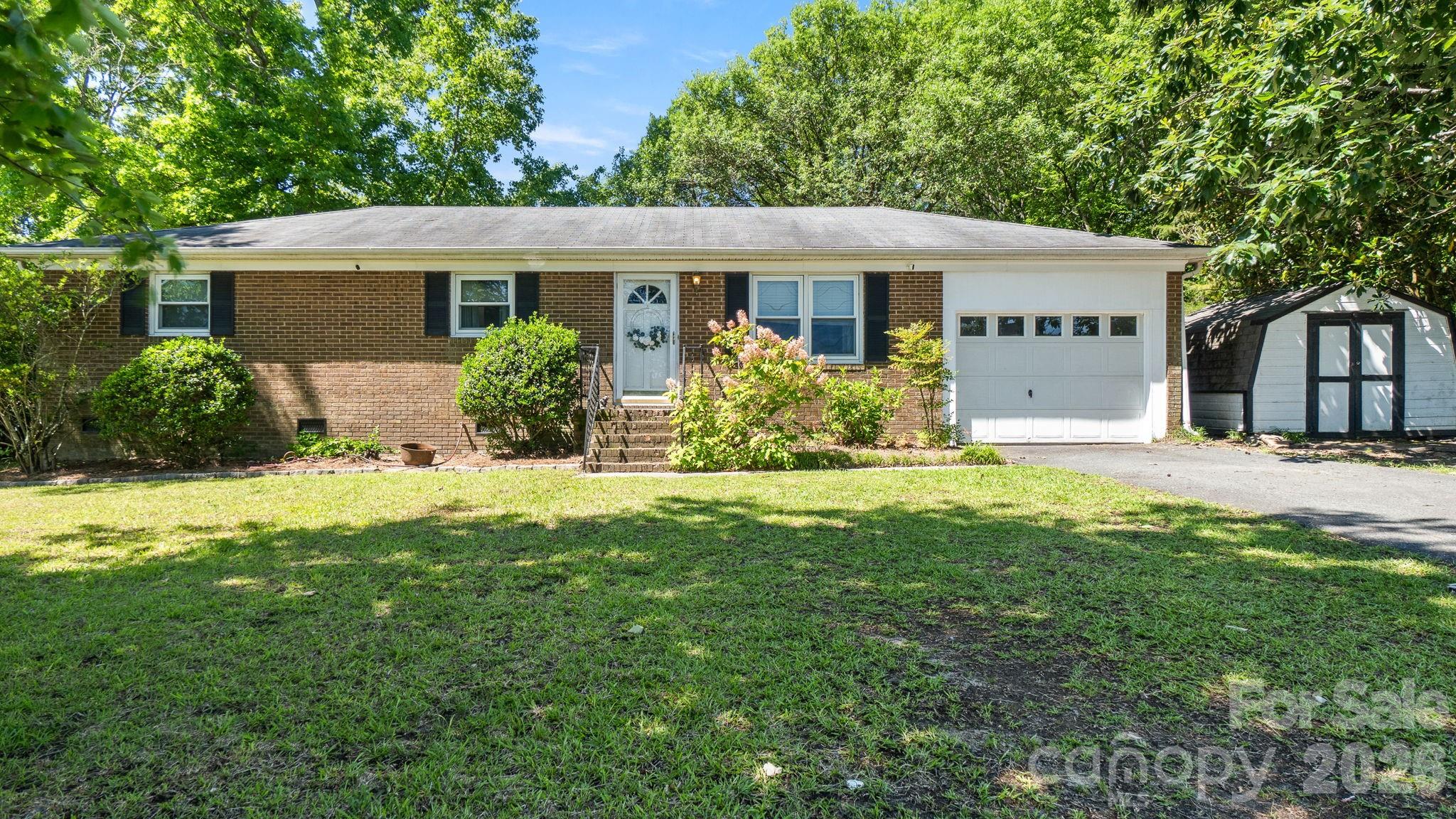 Charming brick ranch on nearly half an acre with no HOA in desirable Union County! This 3-bedroom, 2-bath home offers the perfect blend of comfort, convenience, and opportunity. Inside, you'll find beautiful hardwood floors, a spacious eat-in kitchen, and a renovated primary bathroom. The functional floor plan provides comfortable living spaces and is ready for a new owner to add their personal touches.
Step outside and enjoy the benefits of a large, flat, fully fenced backyard with plenty of room for gardening, pets, recreation, or hobbies. Entertain on the back deck, and relax around the firepit. The property includes a storage shed and chicken coop, offering flexibility for those seeking a more self-sufficient lifestyle. Bring your chickens and enjoy the freedom that comes with owning a property without HOA restrictions. Conveniently located near 74 & I-485, this home provides easy access to shopping, dining, entertainment, and commuting routes while still offering the space and privacy of a larger lot. Situated in the sought-after Union County school district, this property presents an excellent opportunity for buyers looking for affordability, outdoor space, and a great location. Don't miss your chance to own this well-maintained brick ranch with hardwood floors, a fenced yard, no HOA, and nearly half an acre of land in a highly convenient location.