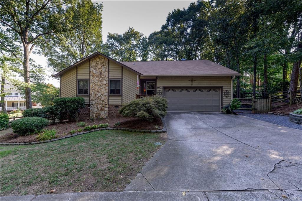 Ranch home in private setting w/fully fenced yard. Great room has floor to ceiling stone fireplace, built-ins, vaulted ceiling and a wet bar with wine frig. Kitchen w/SS appliances, corian counters, built-in computer desk & breakfast bar. Screen porch with tile floor is off dining area and has a spacious deck area perfect for entertaining. Extra gravel parking pad on side of home. Master has french doors out to deck.  Wood blinds on most windows, hardwood in dining/kitchen areas.