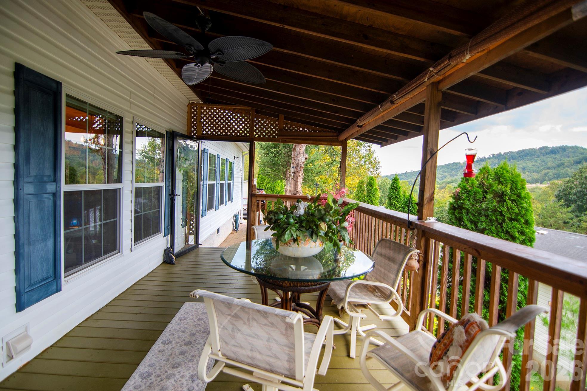 This almost 2000 square-foot ranch-style home features 3 bedrooms and 4 full baths, and endless possibilities! Inside you will find an expansive primary bedroom with double walk-in closets and double ensuites! Yes, 2 full bathrooms. Additionally, the Primary has its own sitting area and room enough for your workspace, too. Enjoy the open-concept living room-to-kitchen floorplan. Read your book by the cozy fireplace in the spacious living room. Cook to your heart's content in the large kitchen with stainless steel appliances and a wide island for enjoying family time. This home could be the right one for a multigenerational family as it has second living quarters. This separate studio suite located past the laundry area with a private entrance includes a kitchenette, bedroom and full bath, ideal for in-laws or guests. Outside, relax on the spacious front porch as you take in the panoramic mountain views every morning. If you rather grill out, the back porch offers an outdoor cooking area. The house's endless features will surely impress!