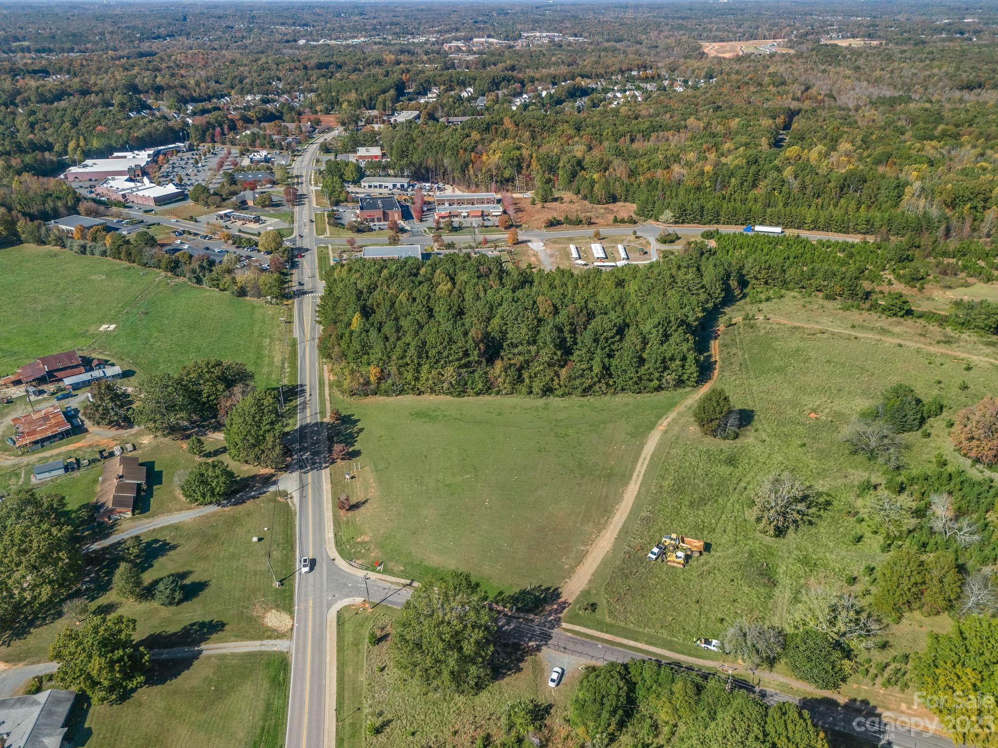 PRIME Corner Lot with HWY 16 ROAD FRONTAGE!!! ATTENTION INVESTORS, BUILDERS, and DEVELOPERS !!!  One of the last vacant lots on HWY 16 in Waxhaw. Endless potential with access to both HWY 16 and Blythe Mill Road.  Inside of the Town of Waxhaw, this 8.01 acres is centrally located between Downtown Waxhaw and many of the other amenities, business, and services that Waxhaw has to provide. There is a brand new townhome development project getting started directly next door. This sale includes 2 parcels. Town Center (TC) zoning allows for the development of larger scale mixed-use buildings that accommodate multi-family, retail, services, offices, studios, medial, restaurants, etc. All utilities are available including  electric, sewer, water, gas, and internet. 

For more info about survey, topography, zoning regulations, utility map, more information from the Mayor of Waxhaw, and questions about sewer capacity, please contact the listing agent.