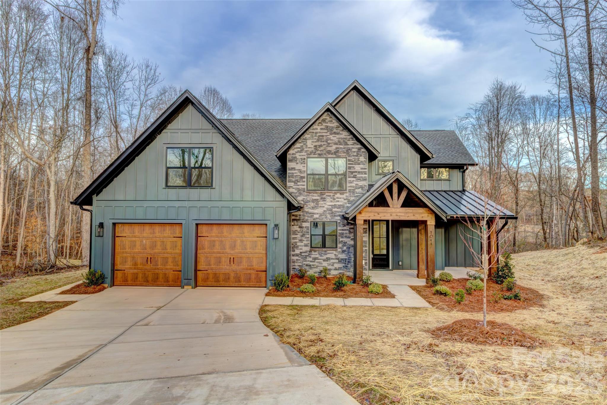 Welcome to country living at its finest in the Bennington Estates community. This brand-new River Birch plan by Oak and Willow Builders is a custom 1.5-story masterpiece, perfectly blending modern luxury with rustic charm through elegant wood and stone accents.

Designed for effortless living, this home features a highly desirable primary suite on the main floor, providing a private retreat with ultimate convenience. The heart of the home is a bright, open-concept great room that flows seamlessly into the well-appointed kitchen. You’ll love entertaining with a large center island, sleek, solid-surface countertops, and a stylish tile backsplash.

The living space extends outdoors to a stunning back porch featuring a vaulted wooden ceiling—the perfect spot to enjoy your expansive 1.89-acre lot. Located in rural Bessemer City, this property offers the rare freedom of a non-HOA neighborhood and includes a 10-year builder’s warranty for total peace of mind.