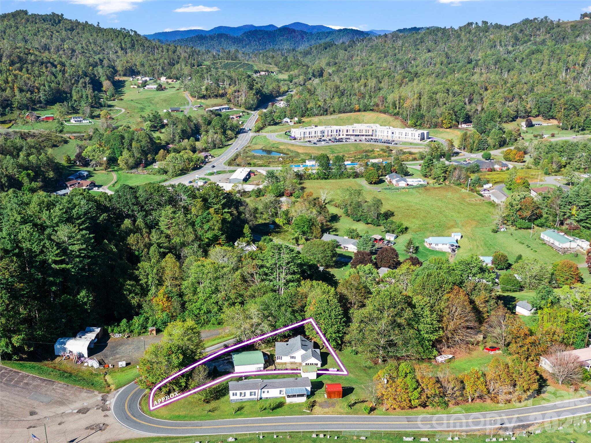 Welcome 370 Bear Creek Church Road, ideally located between Spruce Pine and Bakersville. This 2-bedroom, 1-bath home sits just across the way from the brand-new Mitchell County elementary and middle schools, with the high school nearby as well.

Inside, you'll find plenty of room to grow with two versatile bonus rooms that can easily serve as guest space, a home office, hobby room, or additional living area. A new kitchen floor was completed in 2026!  Outside, the spacious detached garage and additional outbuilding provide excellent storage, workshop space, or opportunities for future projects.

Outdoor  lovers will appreciate being just minutes from both the Appalachian Trail and the Blue Ridge Parkway, putting some of Western North Carolina's most breathtaking scenery, hiking, and outdoor recreation right at your fingertips.

Whether you're searching for a full-time residence, your first home, or a mountain getaway, this property offers great amenities for either!