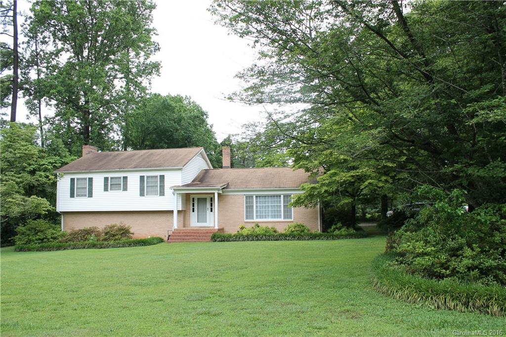 Charming Rock Hill neighborhood with large trees and established homes. Excellent location within a couple miles of I-77 and near downtown too. This beautiful brick home has hardwood floors throughout living, dining, foyer and all bedrooms. Large den on lower level with fireplace and wet bar. Flex space was used as an office on lower level or could make a great sewing room, play room or additional storage.
