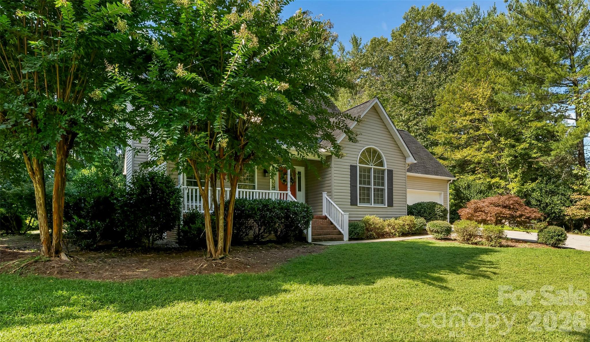 Cape Cod cutie!  Enjoy the lake from this corner location with a short walk to the deeded boat slip.  Main level primary suite is filled with light from large windows and cathedral ceiling.  Ensuite bath has double sinks, shower, jet tub and large walk in closet.  Cozy living room with gas logs and dining area just off the kitchen.  Kitchen has plenty of cabinetry, island seating and a breakfast area.  Direct access to the screened porch off the kitchen which overlooks the beautifully landscaped rear yard.  Laundry and powder room are conveniently located between kitchen and garage access.  Upstairs there are two gracious sized bedrooms with a shared bath as well as a finished bonus room over the garage-perfect for your home office.  As a bonus there is also a 13x19 building with breezeway from the garage has monitor heat and window unit AC. Perfect for a shop, craft or exercise room.  Just 15 minutes to downtown Morganton and close to Fonta Flora Trail & Lake James State Park.  Keep your boat in the deeded slip and enjoy beautiful Lake James. New roof 2025.