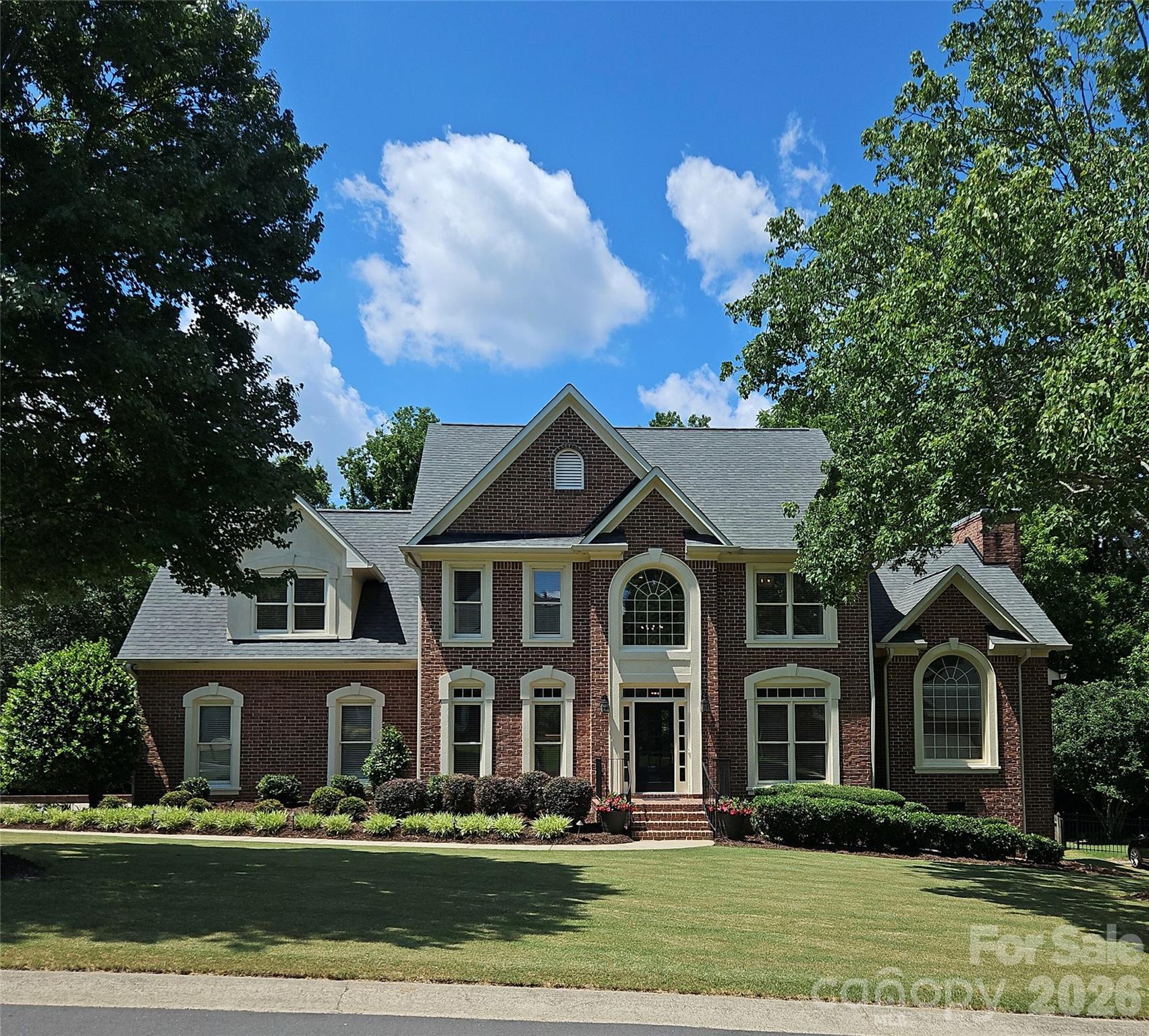 This is IT! Exceptional curb appeal welcomes you home with enhanced professional landscaping and timeless full-brick construction in the highly sought-after Rea Woods community. This beautifully updated John Wieland home offers 4 bedrooms, 3.5 baths, and an inviting floor plan designed for both everyday living and entertaining.

Step inside to a dramatic two-story foyer and a private office with French doors, formal dining room, updated powder room.  The stunning kitchen is equipped with a center island, upgraded stainless steel appliances, gas cooktop with downdraft vent, wall oven with combo microwave/convection oven, walk-in pantry, breakfast area, and a convenient pocket office. The adjacent great room features a gas fireplace, custom built-ins, and abundant natural light. 

The main level offers convenient laundry room with adjacent drop zone near the garage entry.

Retreat upstairs to the peaceful owner's suite showcasing a beautifully remodeled spa-inspired bath with new countertops, flooring, tilework, freestanding soaking tub, mirrors, and fixtures. Two large walk-in closets and a versatile flex room provide the perfect space for a nursery, home office, hobby or fitness space. Three additional secondary bedrooms, with one of them includes an ensuite bath.

Additional recent improvements include a newer roof (2020), upstairs HVAC (2021), gas water heater (2021), upgraded millwork, hardware, lighting, added gutters, and landscape lighting.

Outdoor living with an expansive rear deck overlooking the large, level backyard. An oversized 2-car garage with storage room completes the package.

Ideally located in South Charlotte, Rea Woods offers unparalleled convenience to premier shopping, dining, and entertainment, with easy access to SouthPark, Ballantyne, Uptown Charlotte, I-485, and Charlotte Douglas International Airport. A truly move-in-ready home in one of Charlotte's most desirable locations! HURRY!