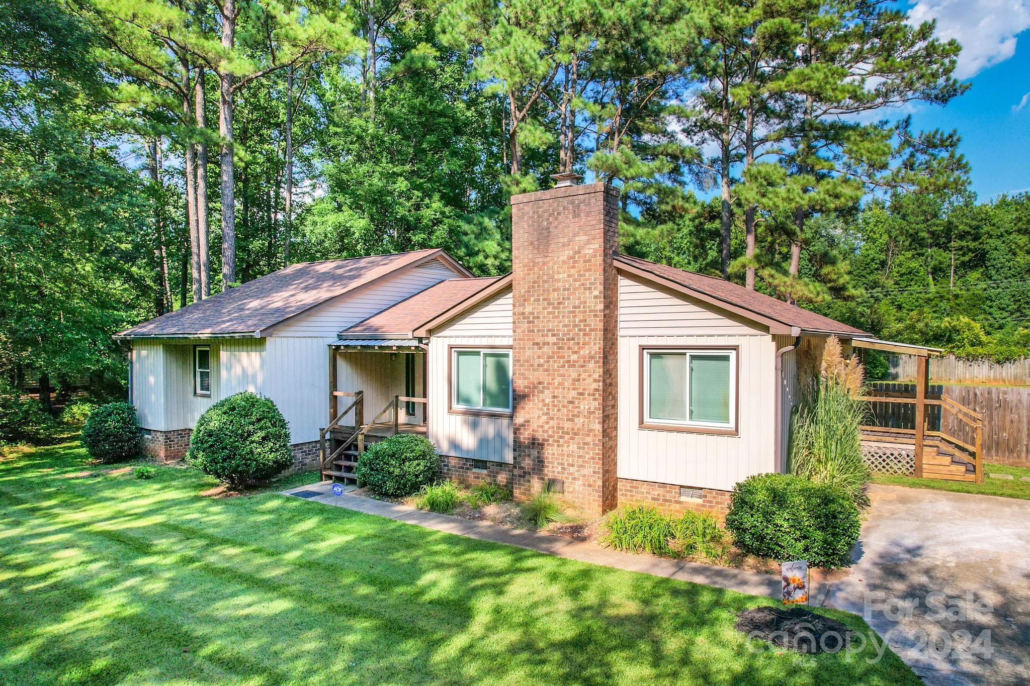 Discover this charming 3-bedroom, 2-bathroom home, perfectly situated on a large .8-acre lot with no HOA. This property boasts newly installed luxury vinyl plank floors throughout, offering both style and durability. The highlight of the home is the large living room, perfect for gatherings and everyday relaxation.

Enjoy the privacy of a fenced-in backyard with a beautiful large covered deck, ideal for outdoor activities, pets, or gardening. Conveniently located close to shopping, and restaurants, with easy access to I-77, this home offers the best of both comfort and convenience.

Don’t miss your chance to own this spacious and updated home in a prime location. Schedule a showing today!

2020 roof, Heat pump/new duct work 2019,